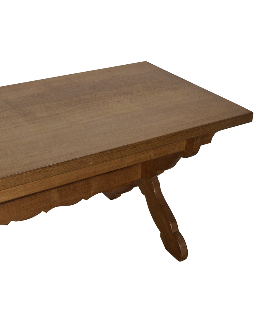 Vintage French oak Drapers dining table, close-up of decorative scalloped apron.
