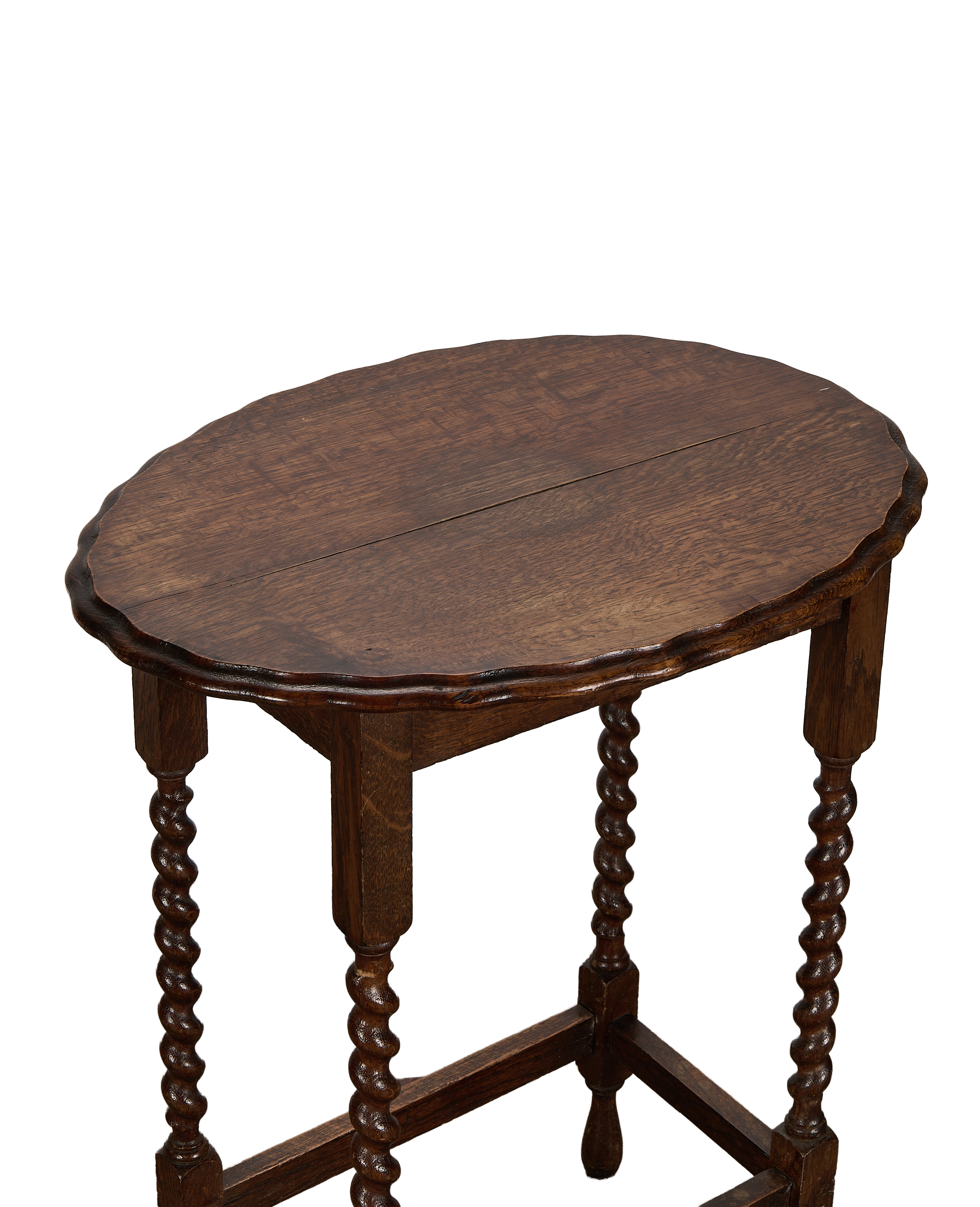 Vintage French oak barley twist table, showing carved scalloped edge and tabletop grain.