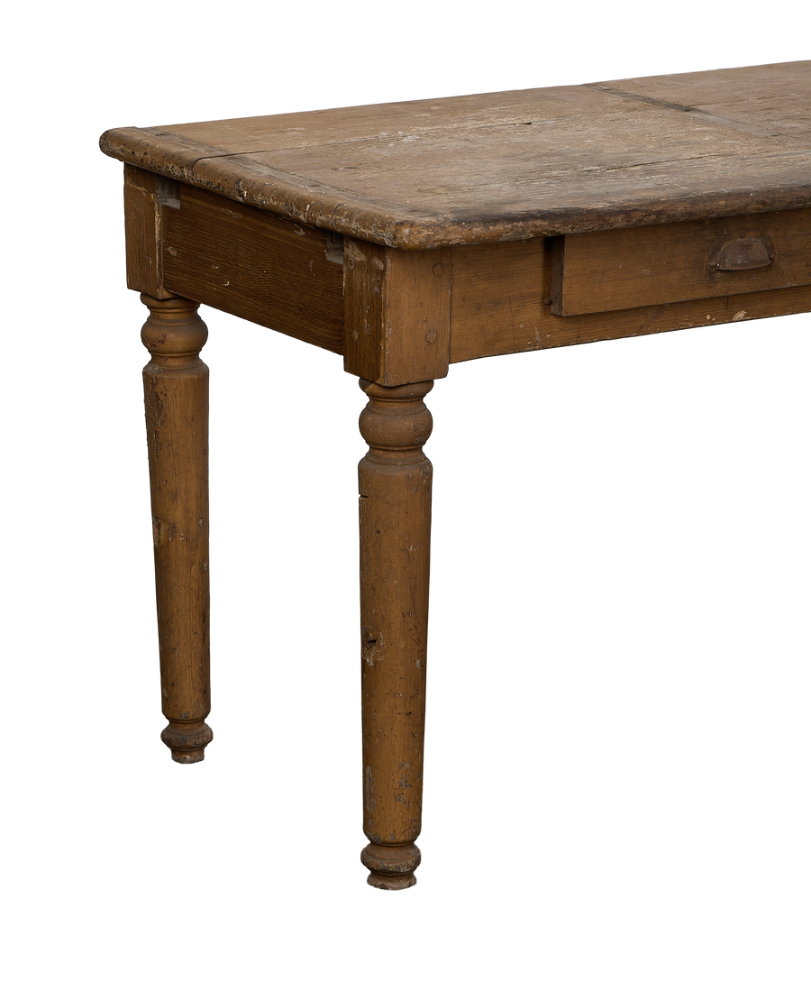 Vintage French oak monastery table, showcasing a distressed top and turned legs from a side angle.