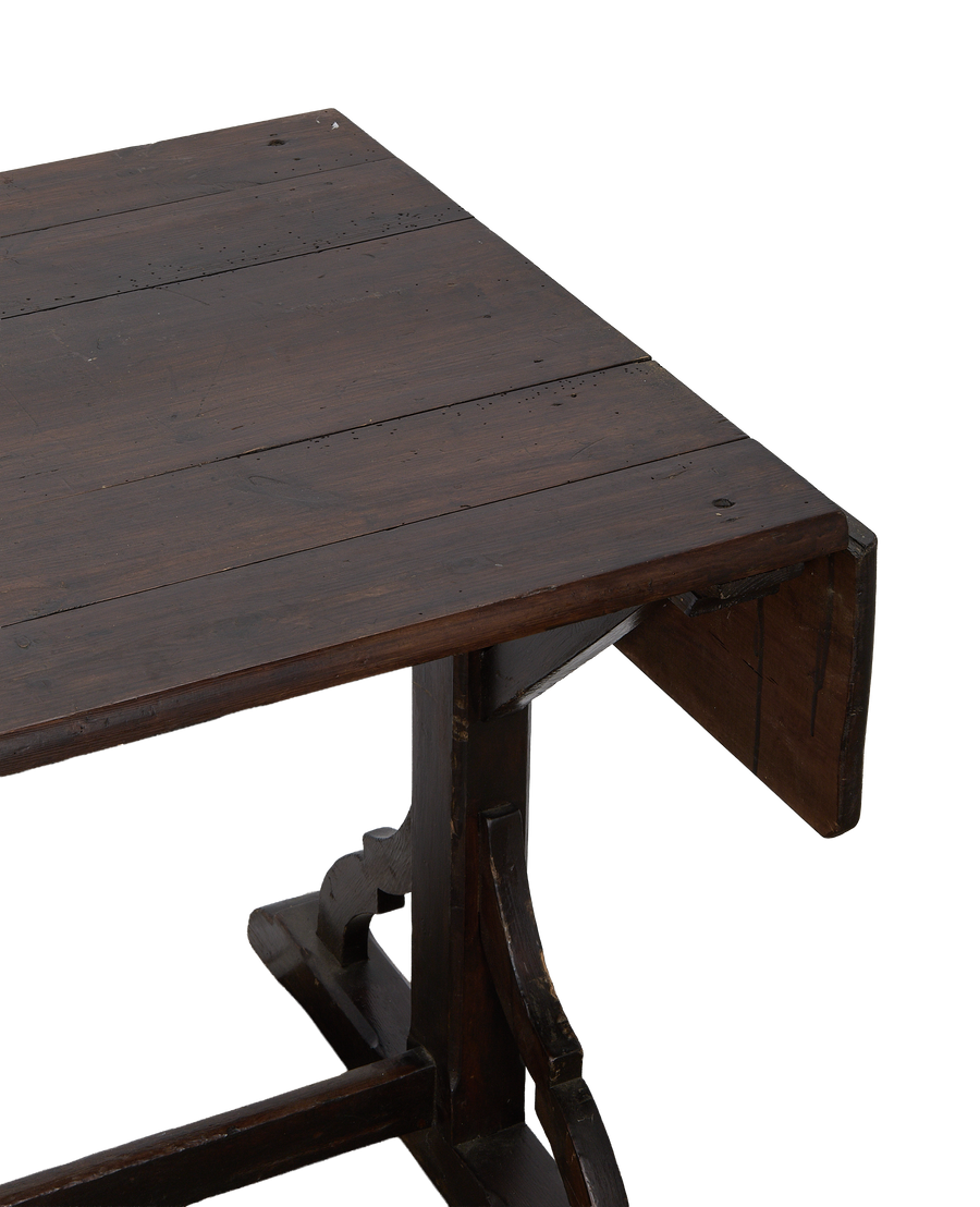 Right corner of vintage French oak drop-leaf table, showing detailed construction.
