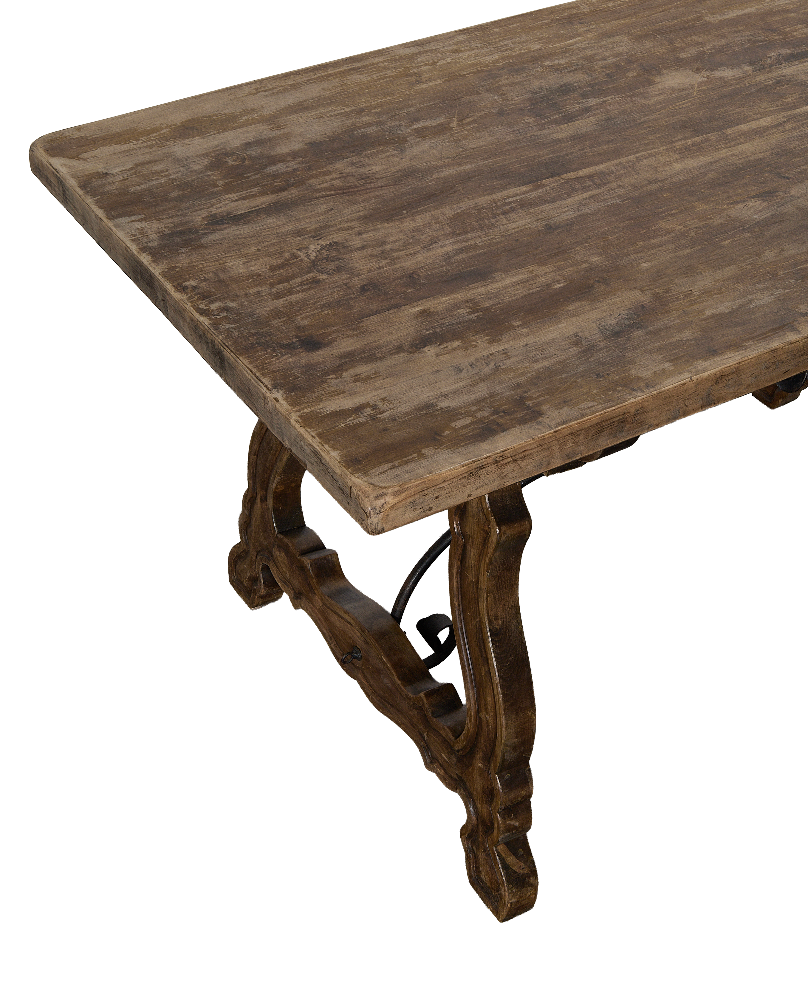 Vintage French oak refectory table's distressed tabletop finish and detailed stretcher support.