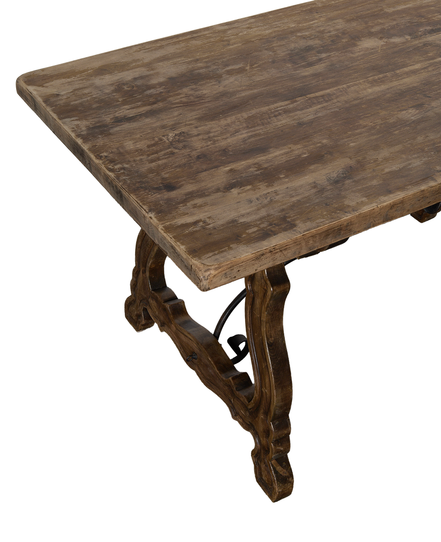 Vintage French oak refectory table's distressed tabletop finish and detailed stretcher support.