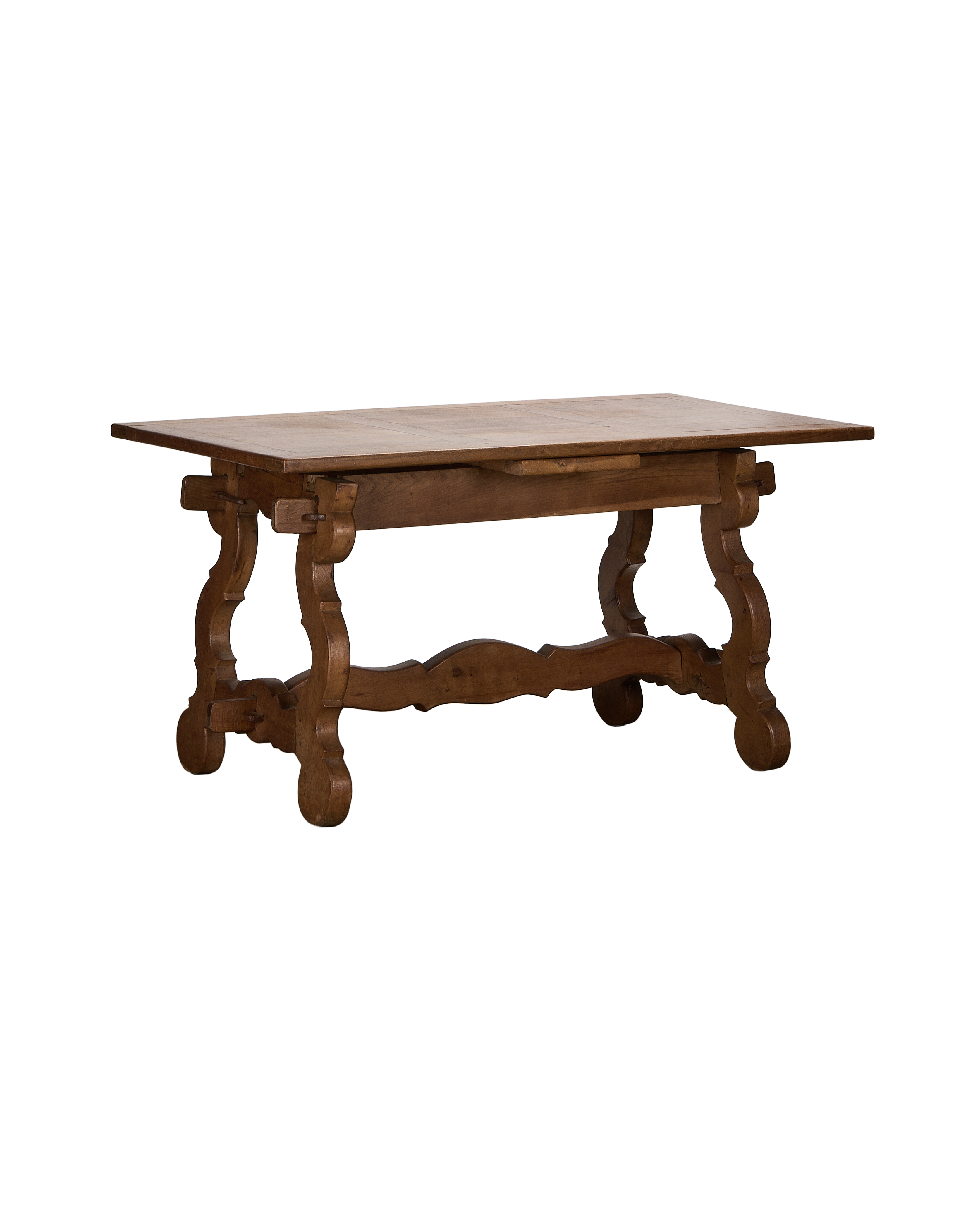 Vintage French oak refectory extendable dining table, full view, with ornate scrolled legs.
