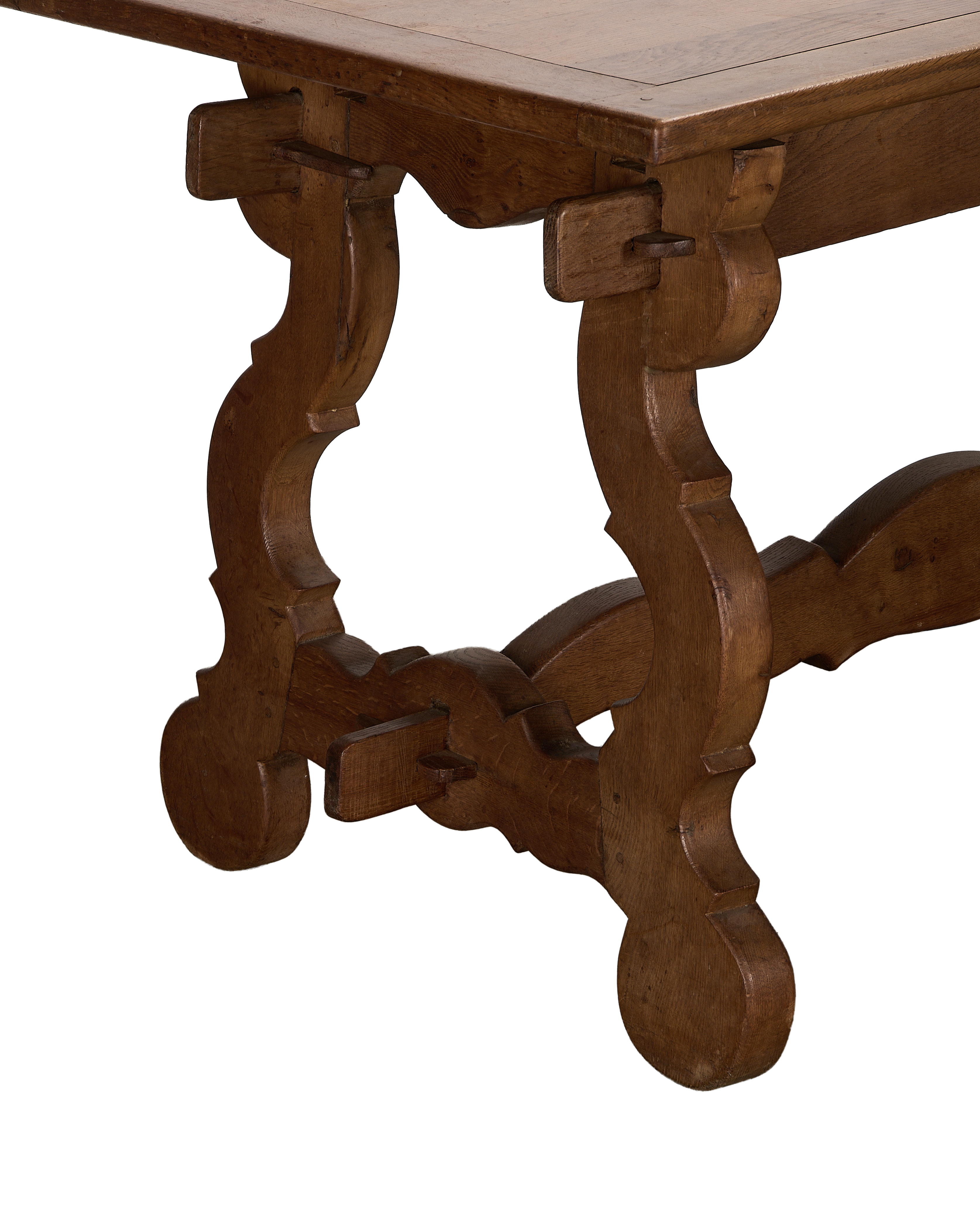 Vintage French oak refectory table's ornate extendable base, showcasing craftsmanship and sturdy construction.