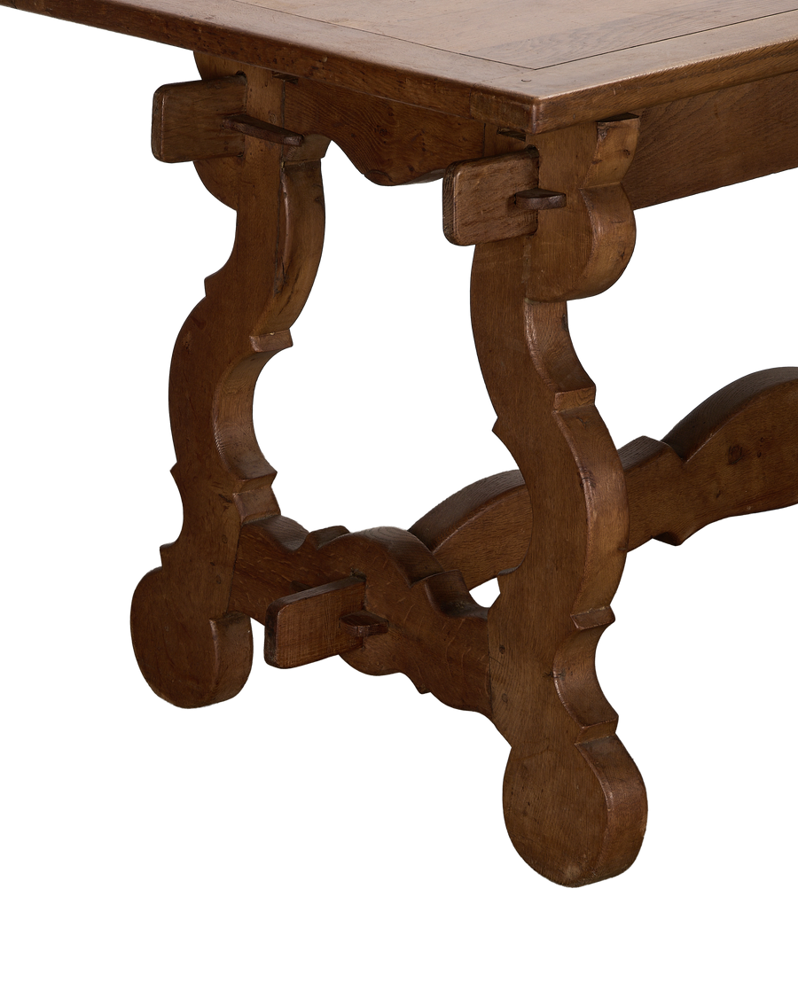 Vintage French oak refectory table's ornate extendable base, showcasing craftsmanship and sturdy construction.