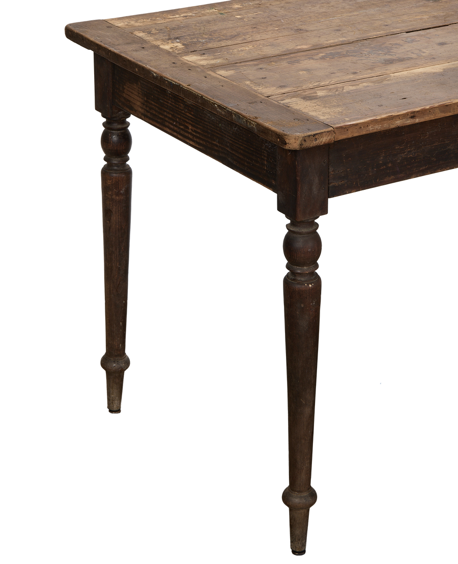 Vintage French distressed black oak table, close-up showing worn tabletop and turned legs.