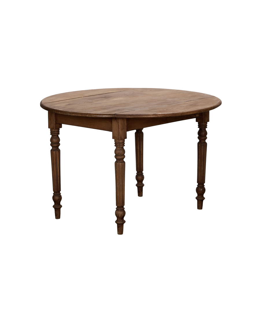 Vintage French oak drop leaf table, partially open, showing elegant turned legs.