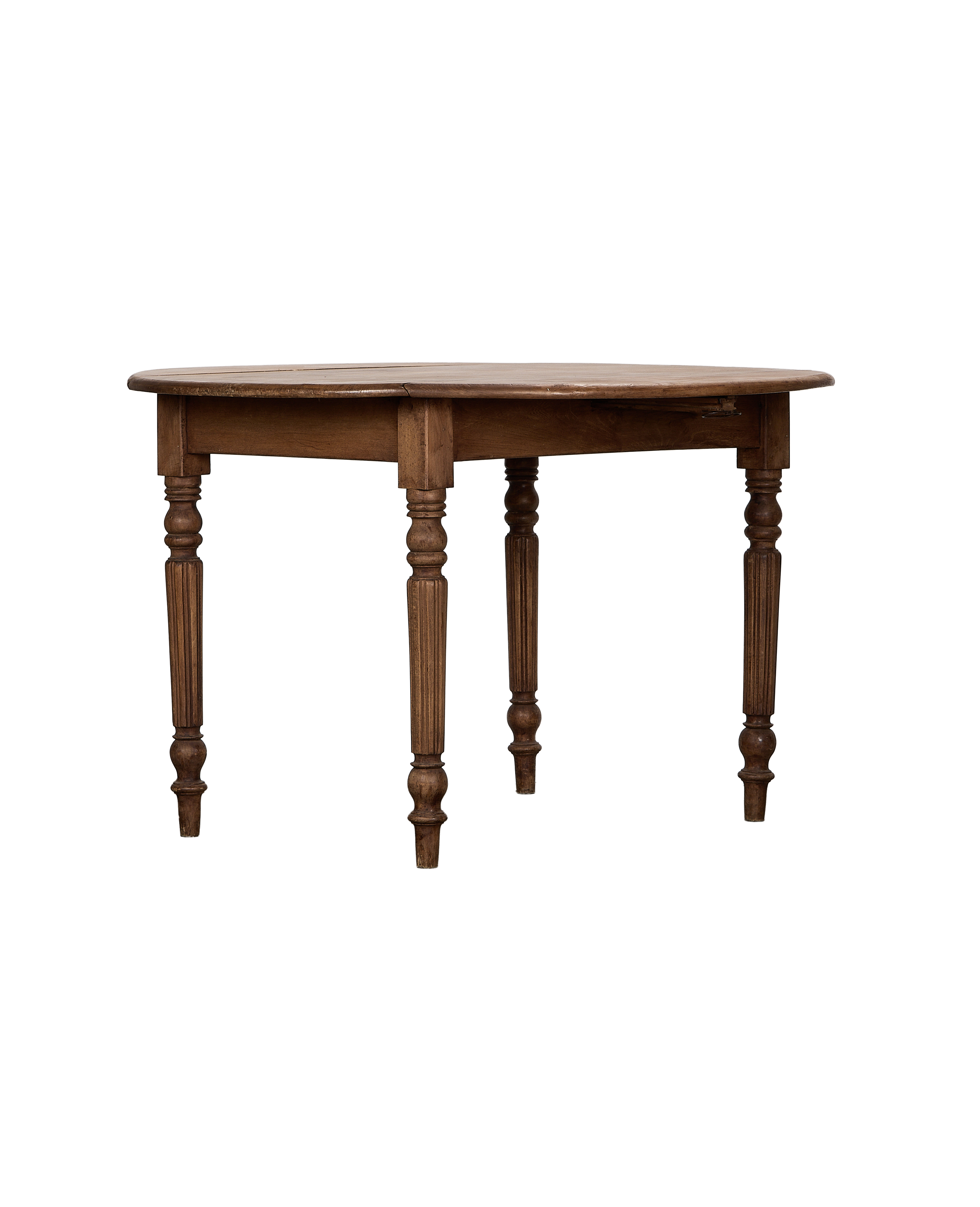 Vintage French oak drop leaf table, closed position, showing turned fluted legs.