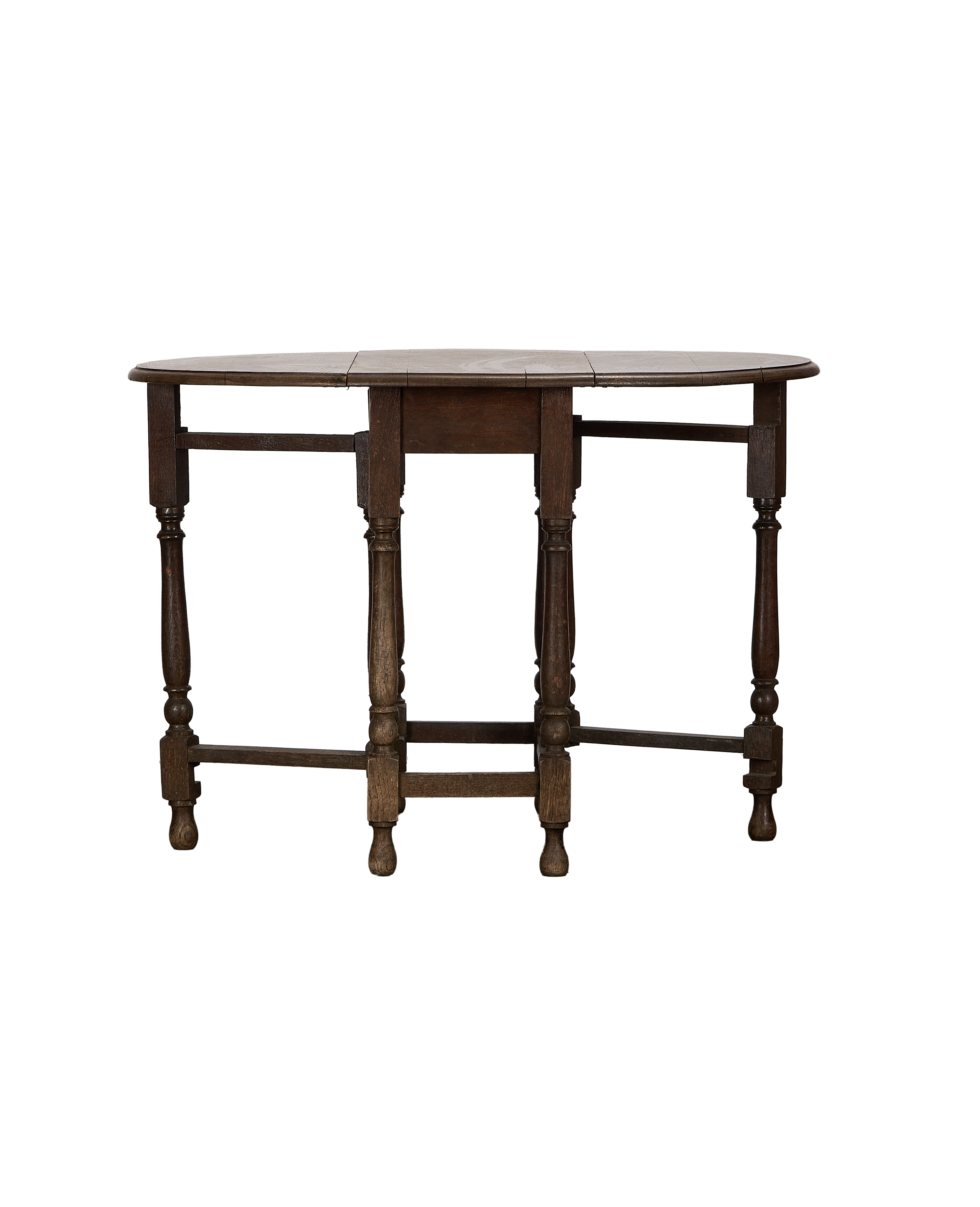 Vintage French oak drop gate leg table, extended top, showcasing turned legs and stretcher.