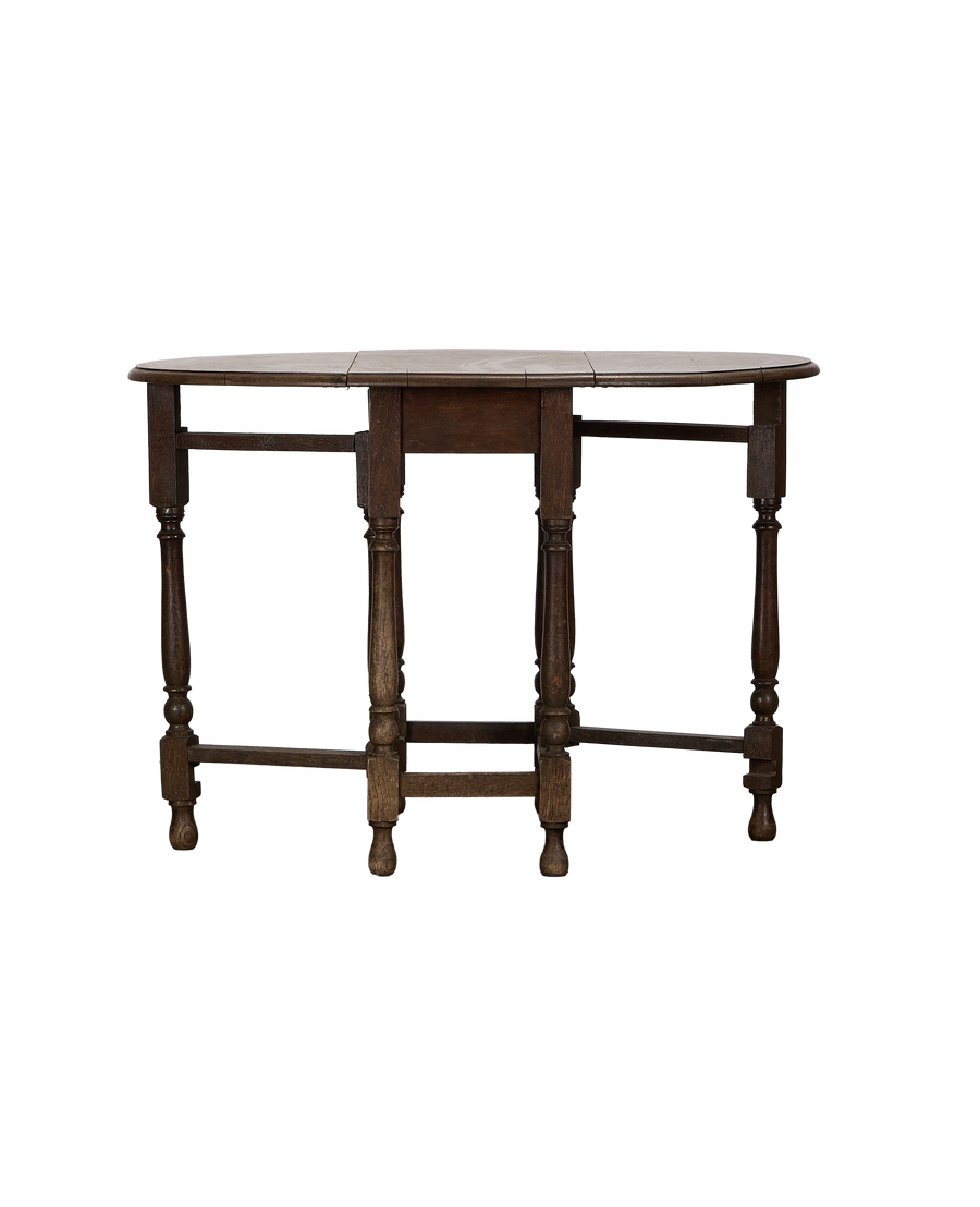 Vintage French oak drop gate leg table, extended top, showcasing turned legs and stretcher.