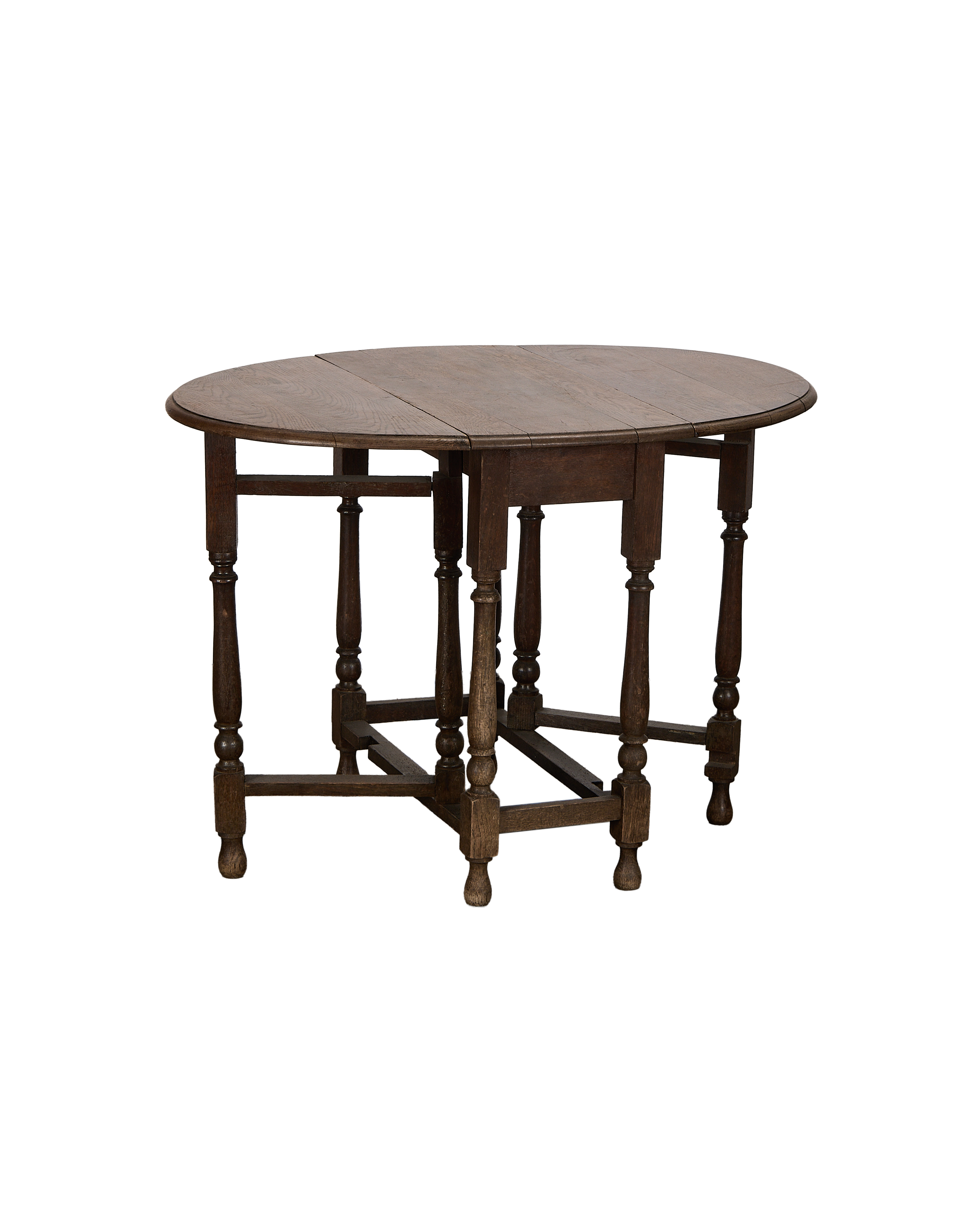 Vintage French oak drop leaf gate leg table, showing lower stretcher details and turned legs.