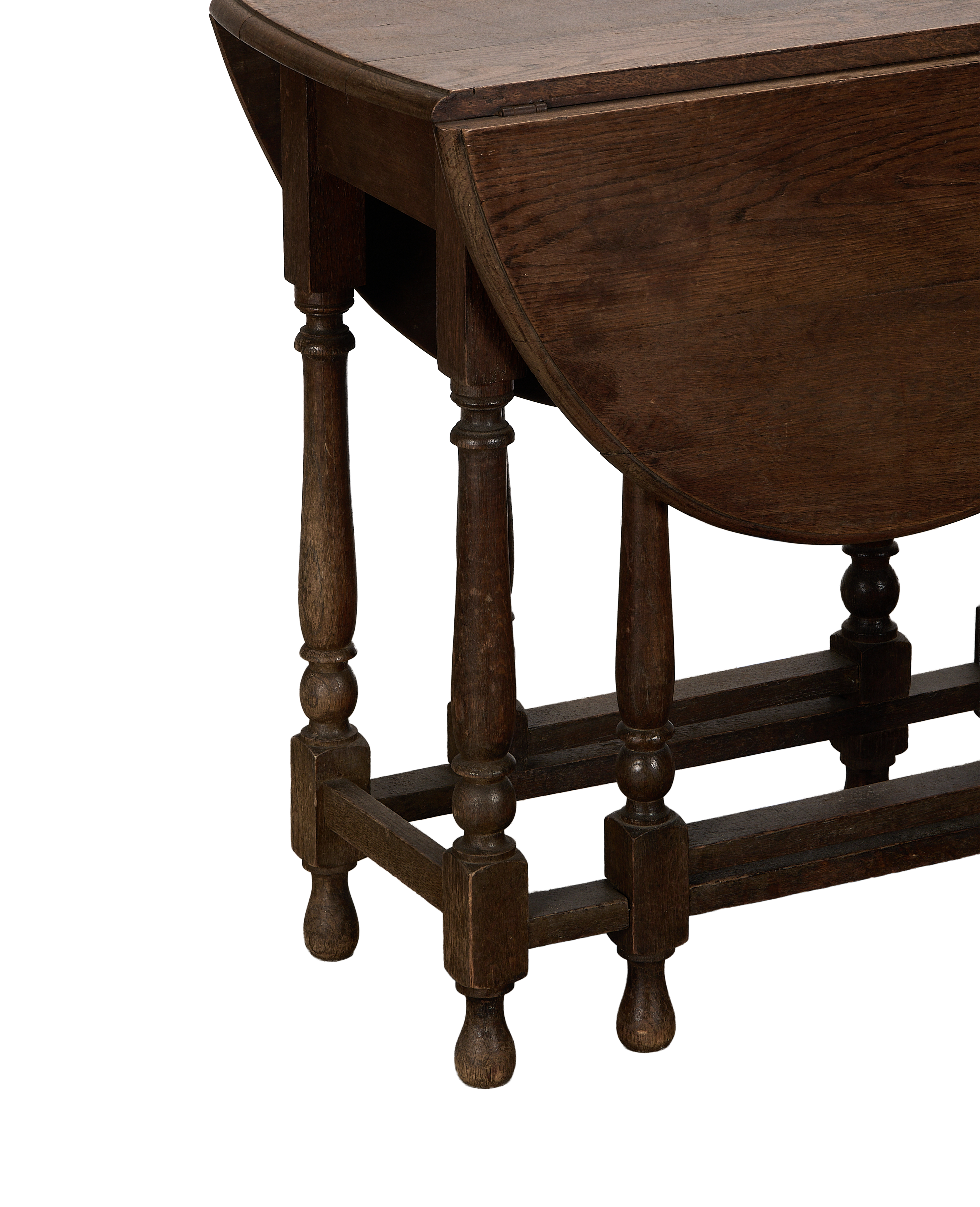 Vintage French oak Drop Gate Leg table, showing folded leaf and turned legs.