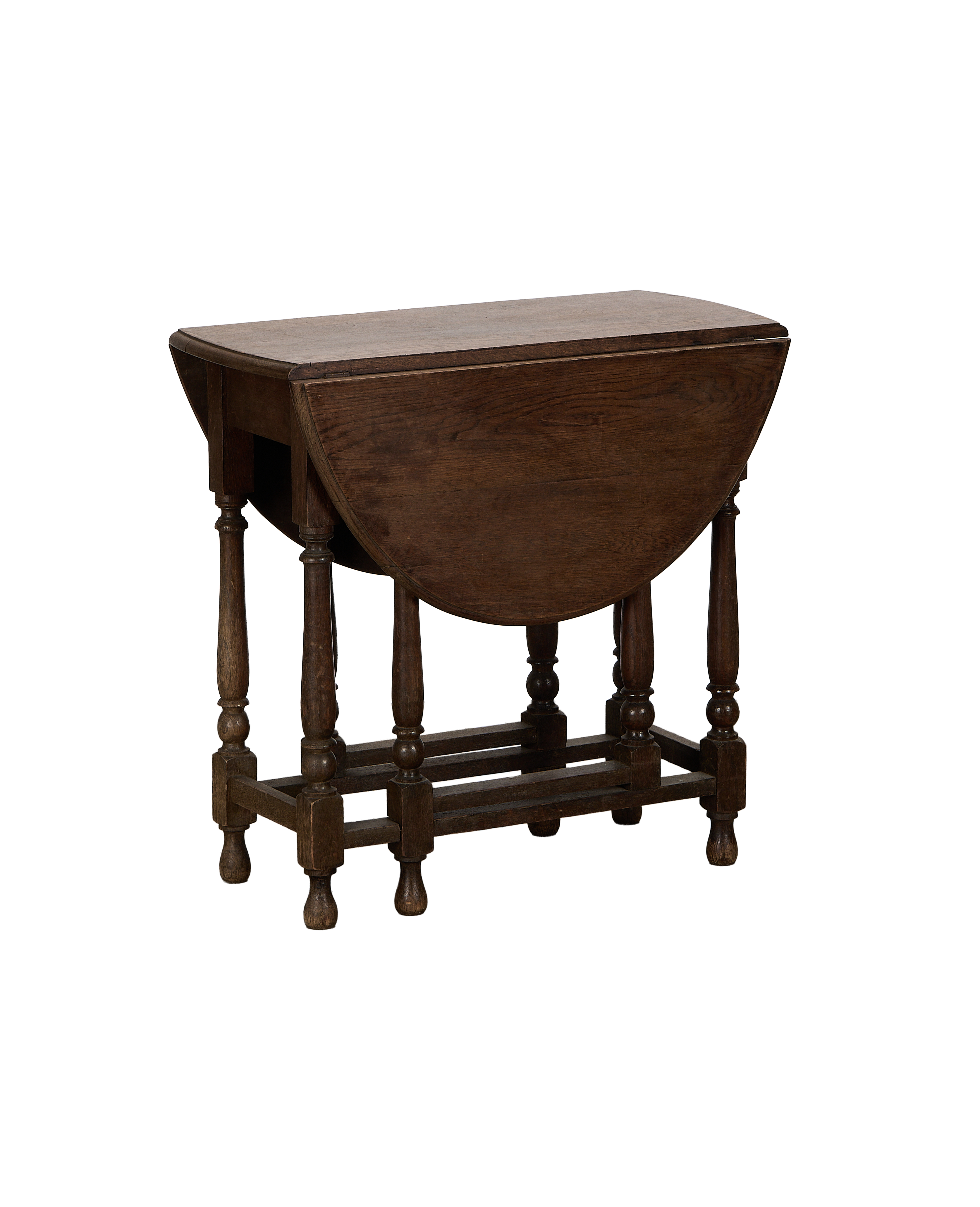Vintage French oak drop leaf gate leg table, closed, showing elegant turned legs.