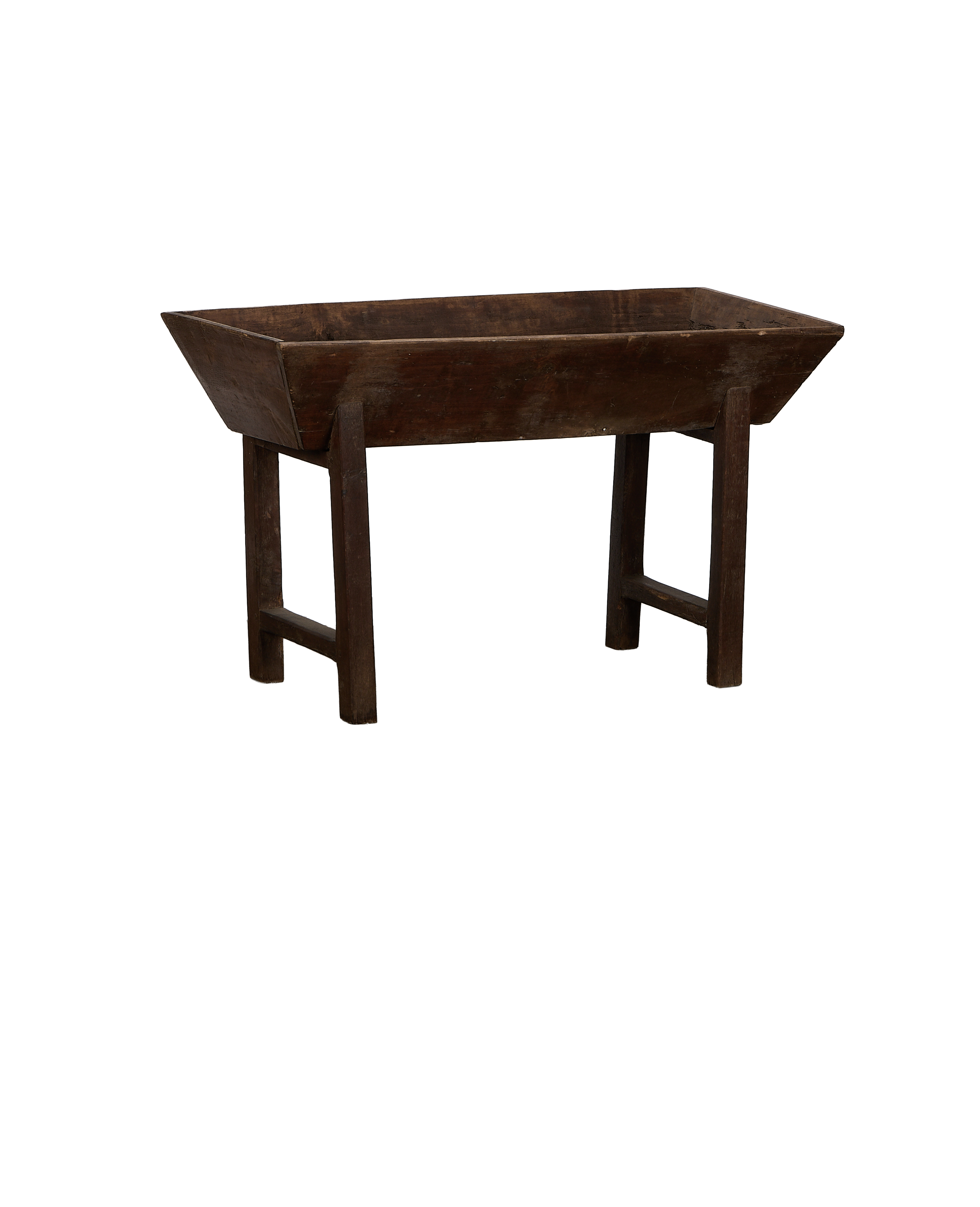 Vintage French oak Petrin table, showing angled view of rustic trough and distressed wooden legs.