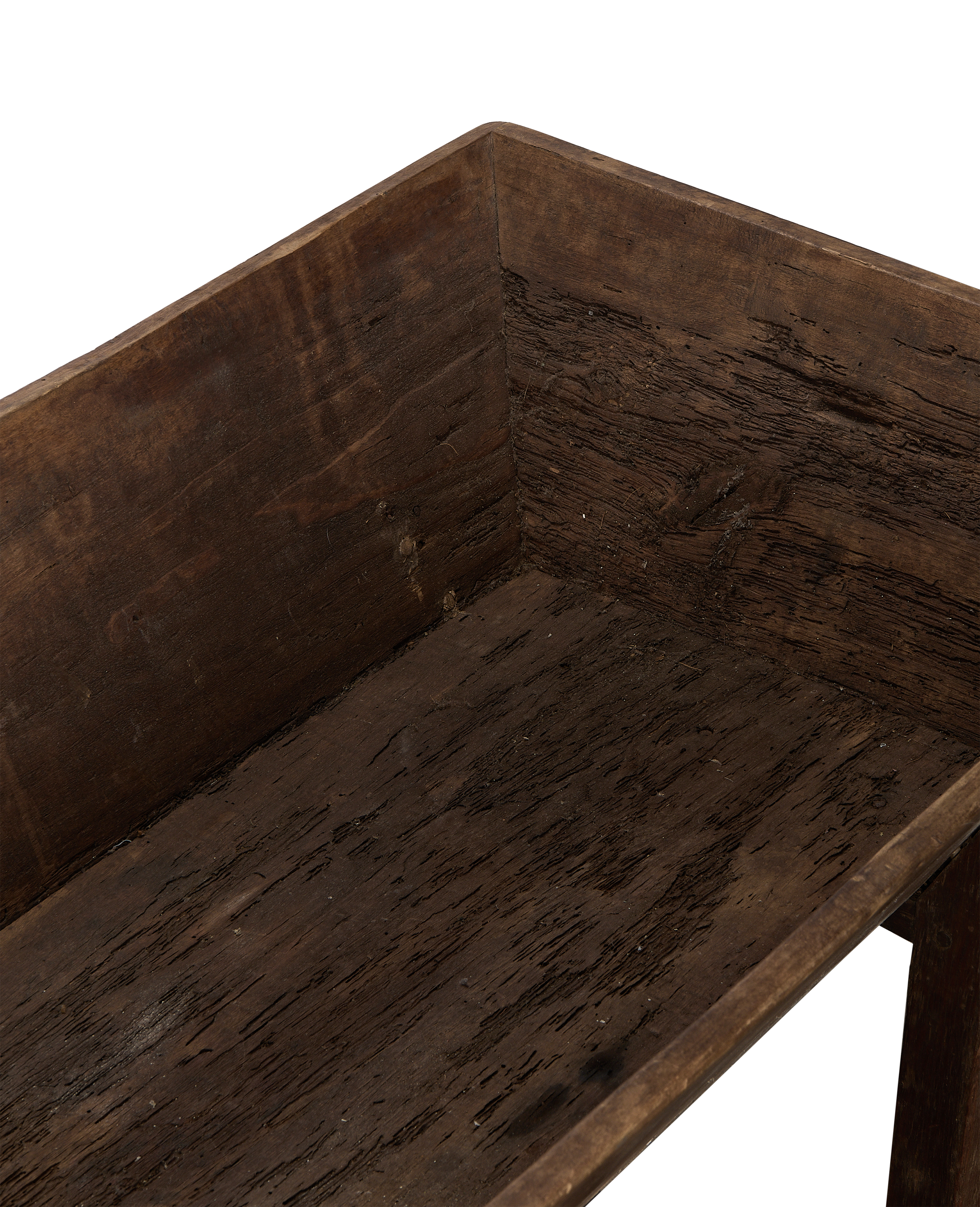 Close-up of vintage French oak Petrin table interior, showing aged wood grain.
