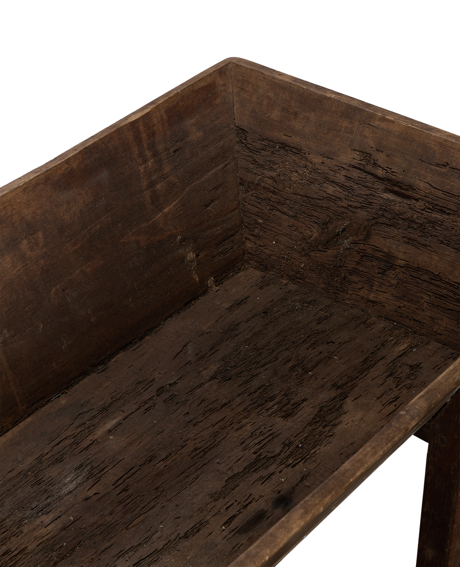 Close-up of vintage French oak Petrin table interior, showing aged wood grain.
