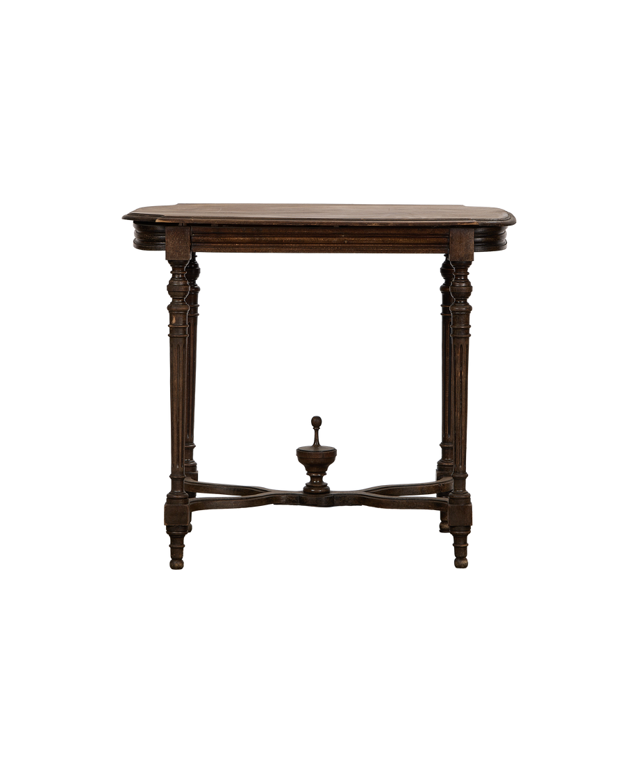 Vintage French Napoleon-style oak table, showing cross-bottom stretcher and turned legs from front.