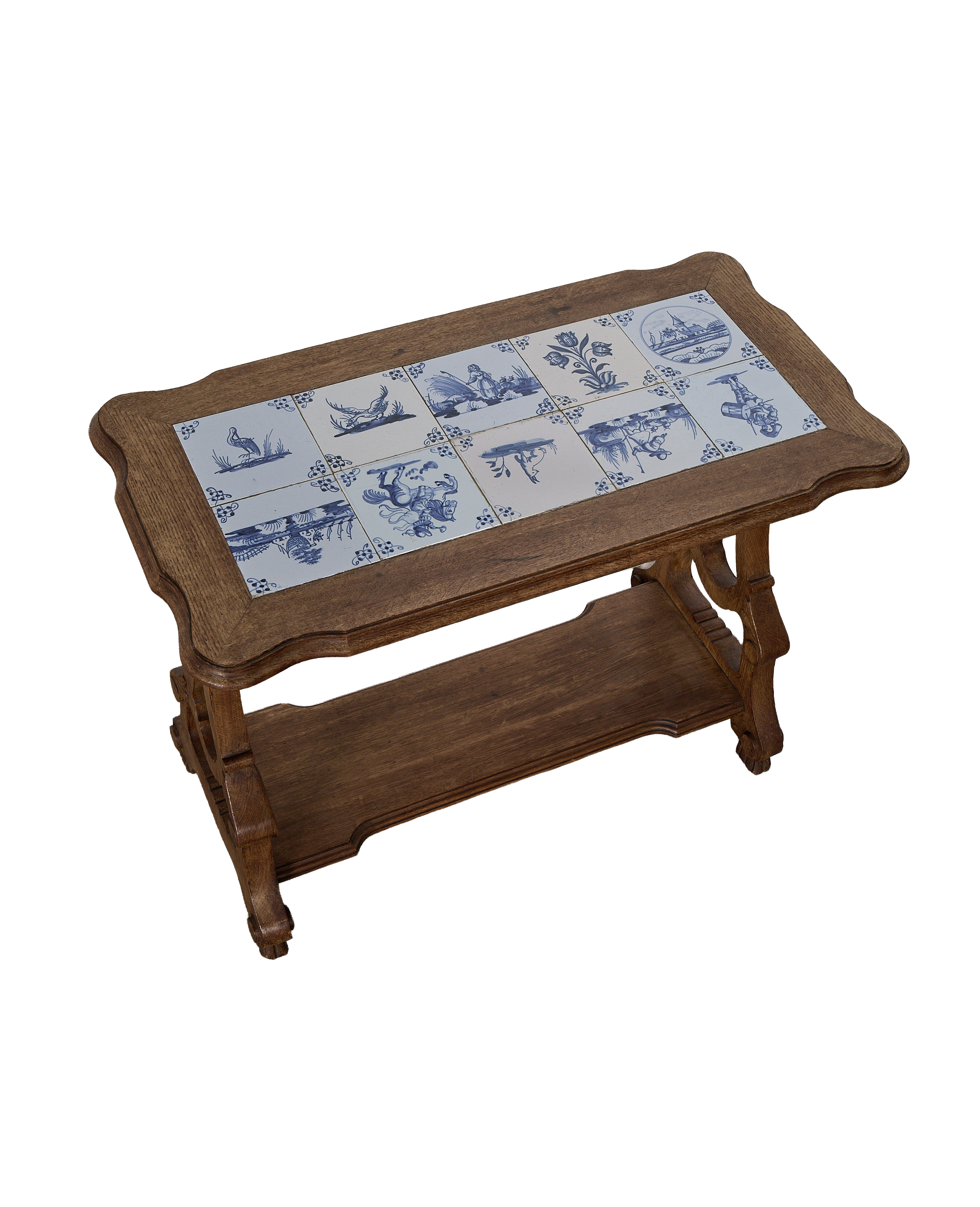 Vintage French oak table with curved base and Delft tile top.