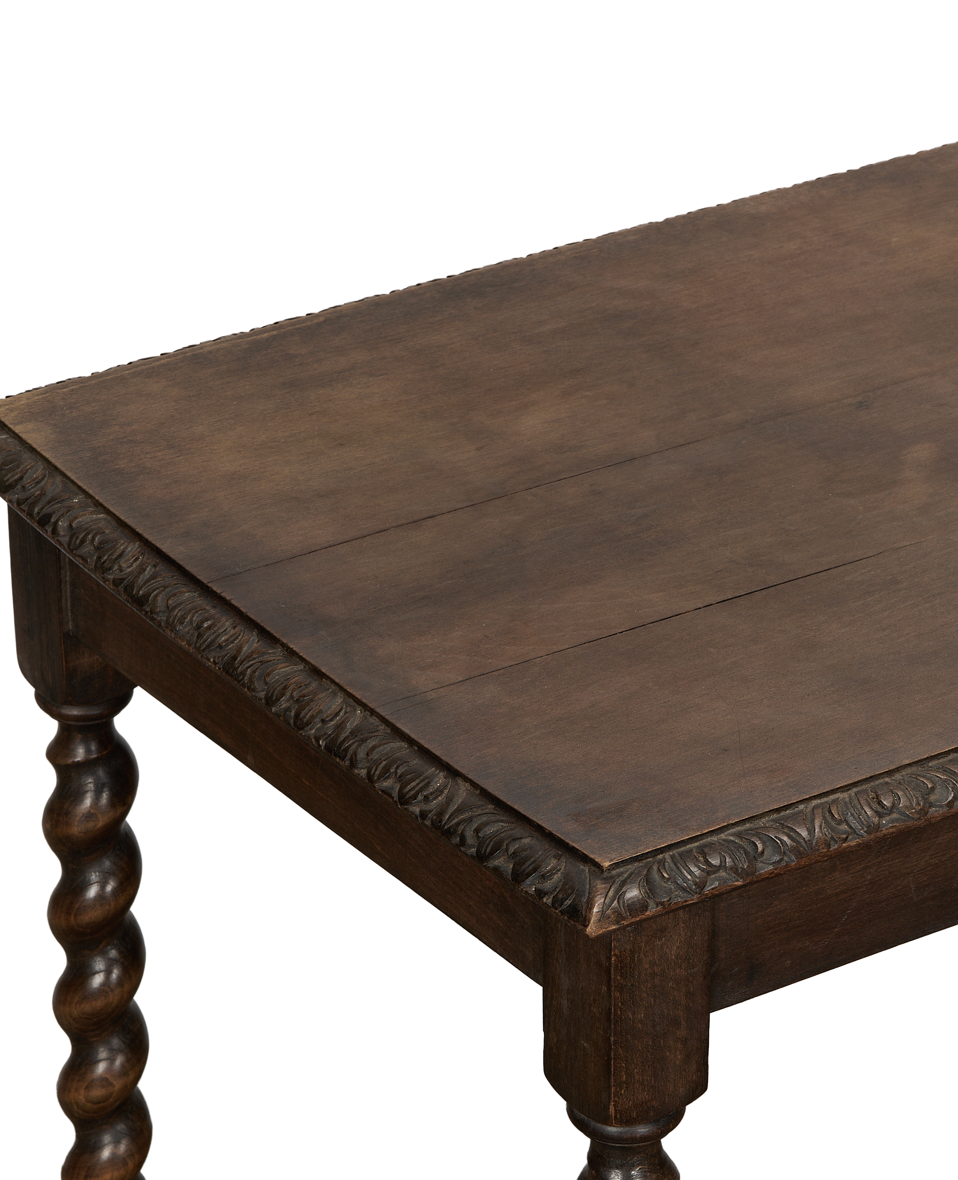 Vintage oak entry table close-up showing carved apron detail, barley twist legs.