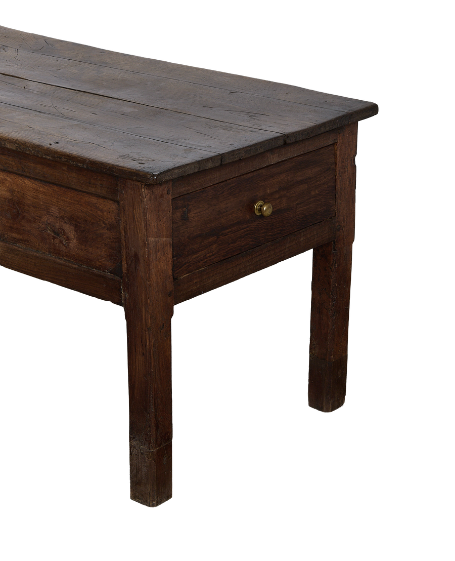 Vintage French oak drawer table, close-up showing distressed top and brass knob.