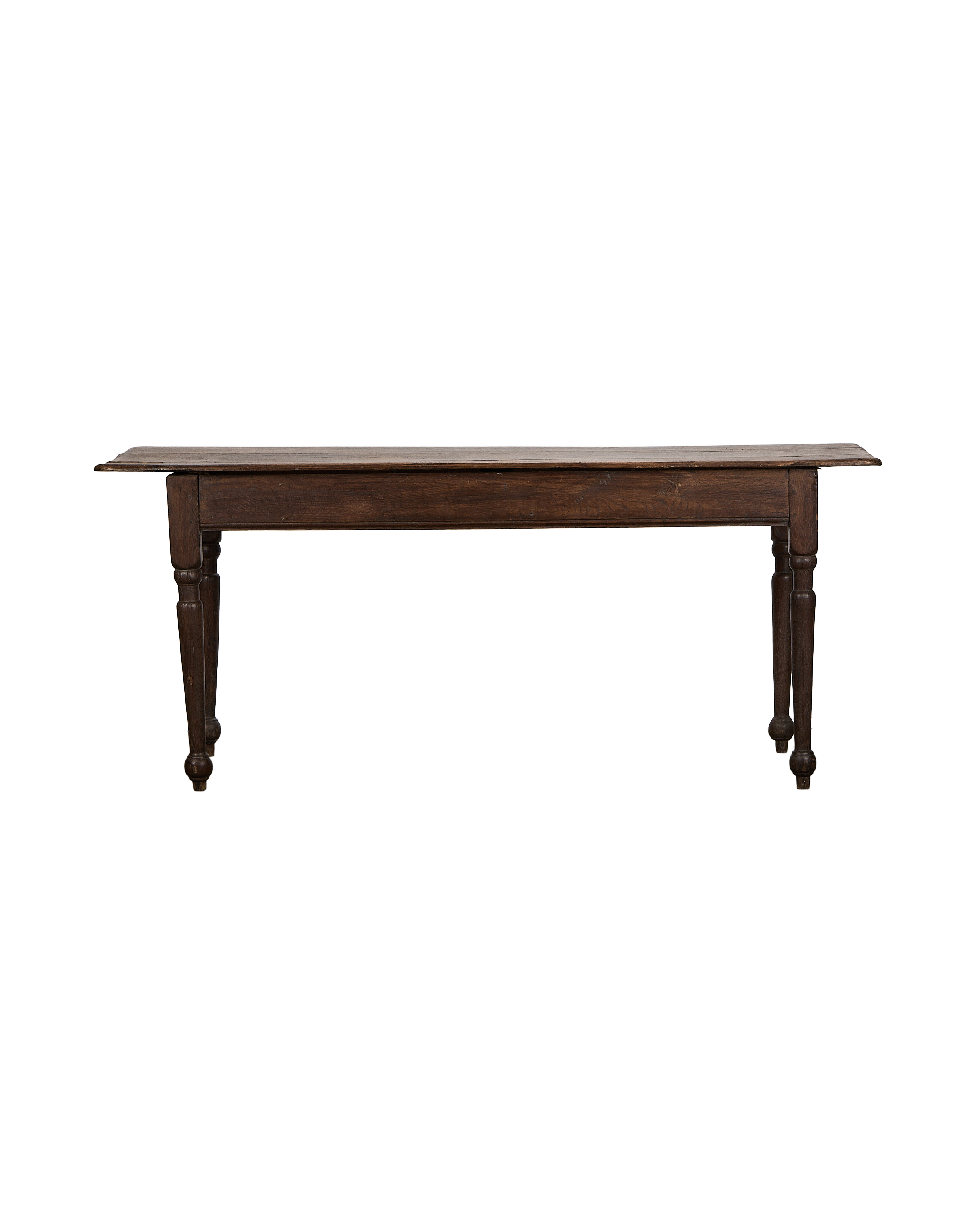 Vintage French oak farm table, showing the full length and turned legs.