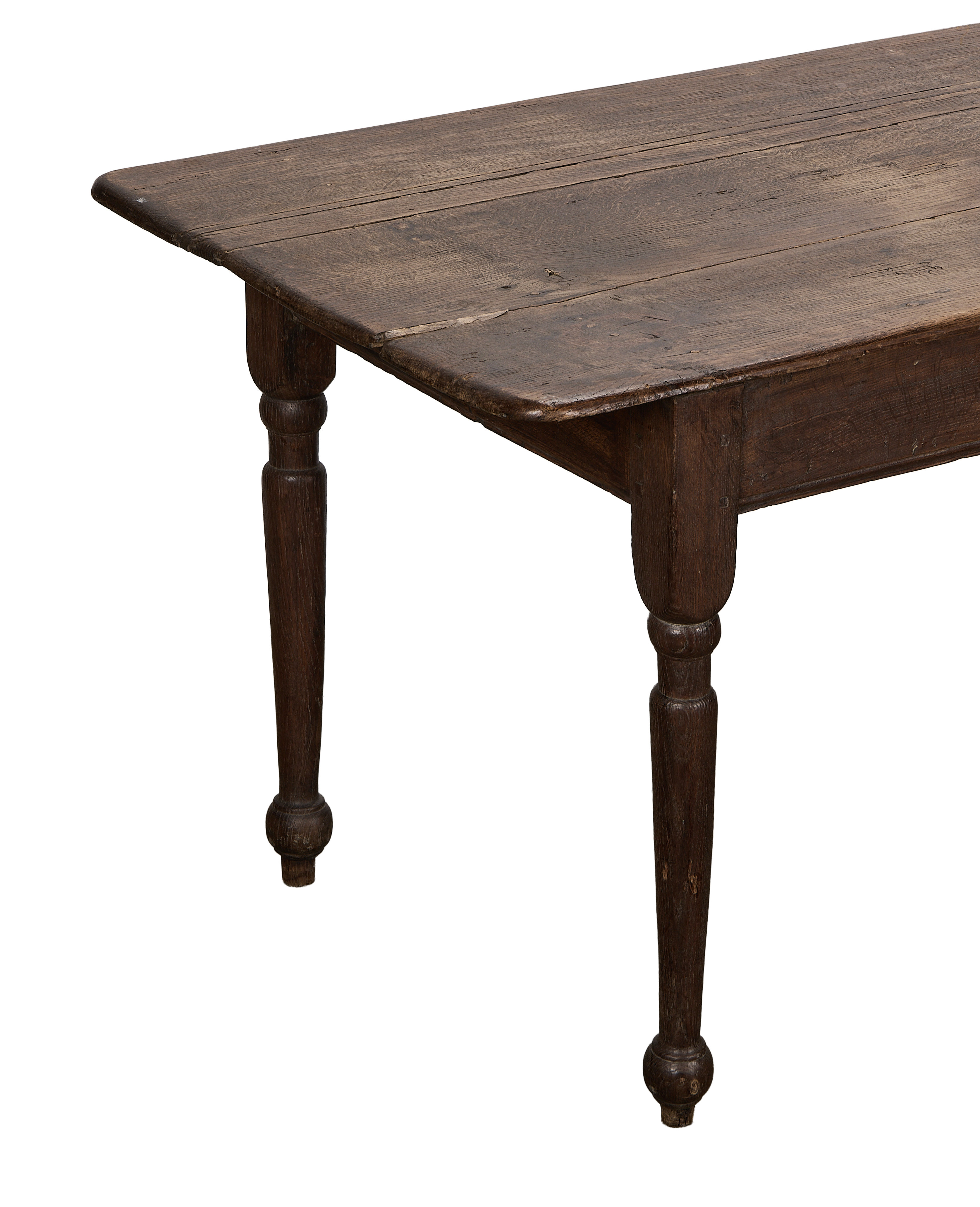 Vintage French oak farm table, showing the dark, rustic tabletop texture and turned legs.