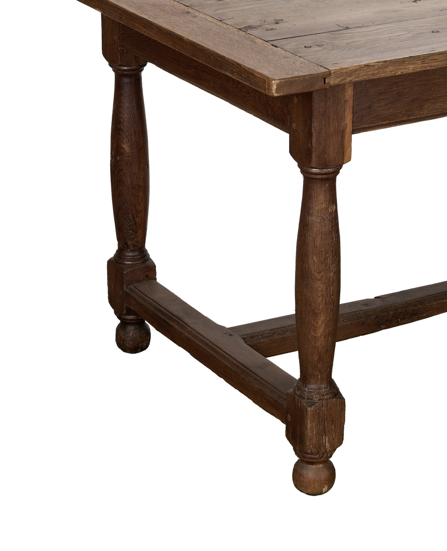Vintage French oak farm table showing turned legs and stretcher, good condition.