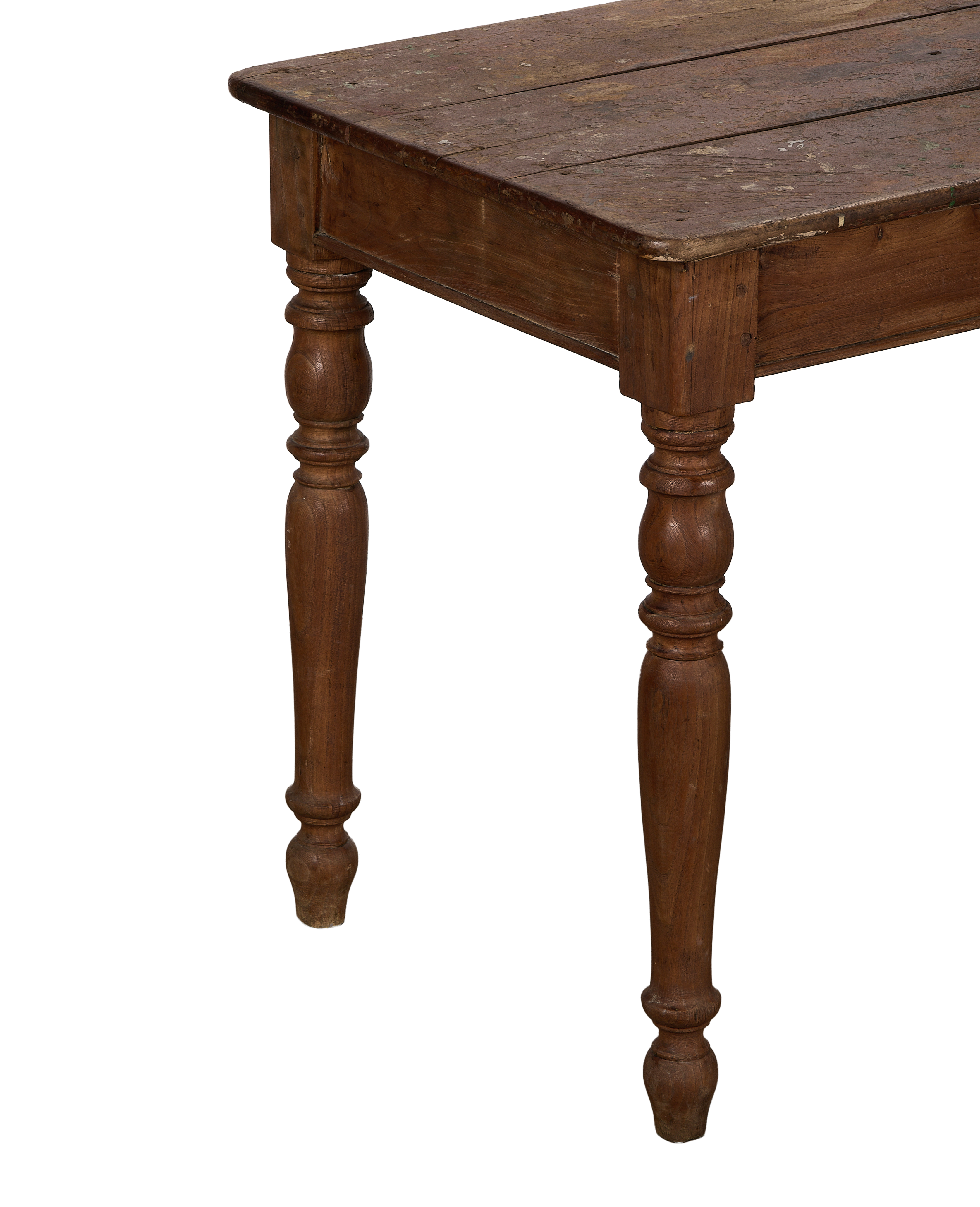 Vintage French oak farm table, showing aged wood grain and turned legs from a low angle.