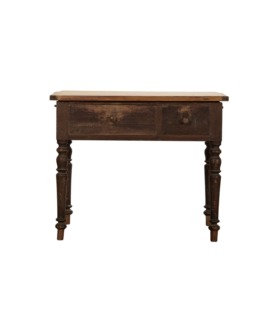 Vintage French oak kitchen island, front view, showing distressed dark wood and turned legs.
