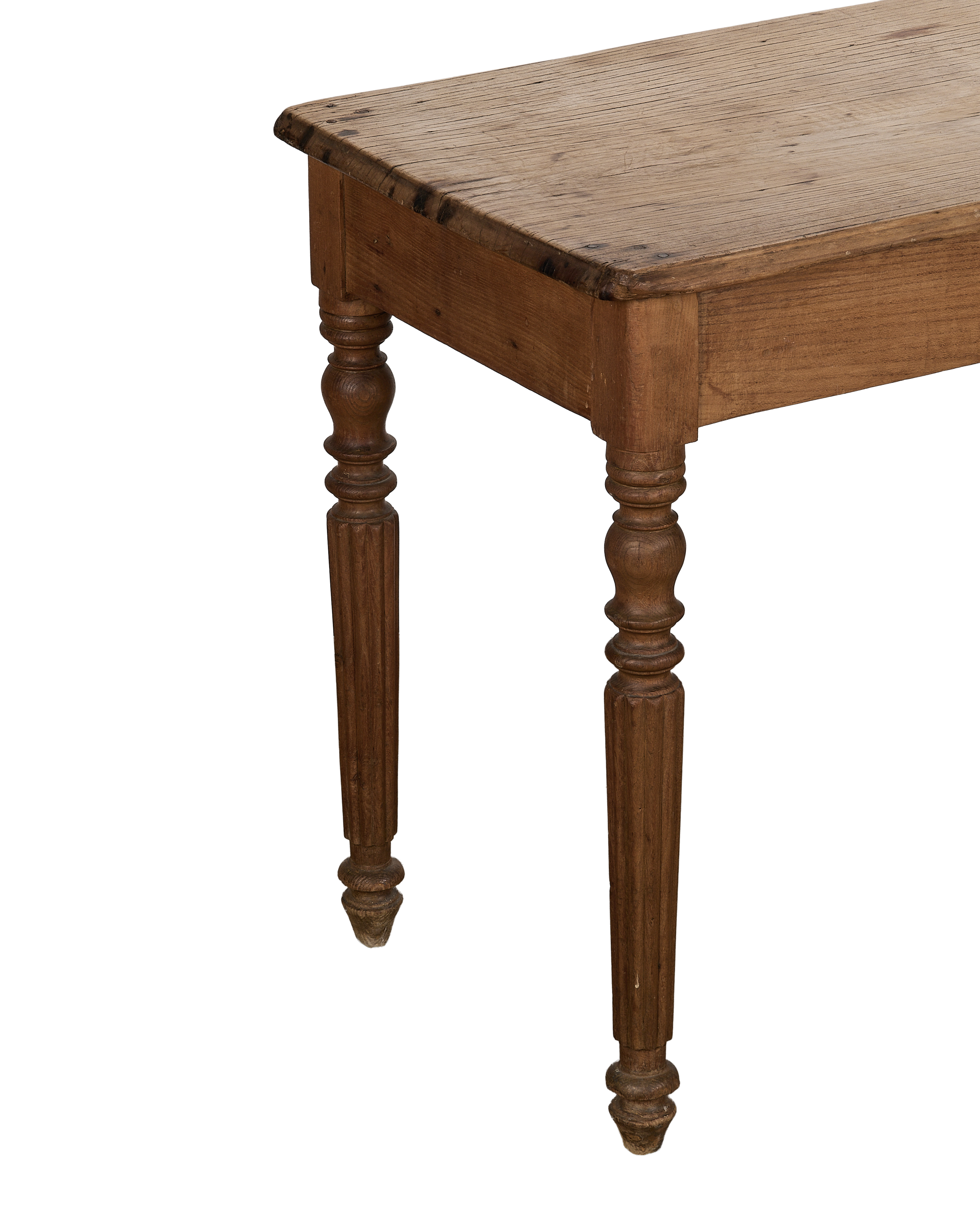 Vintage French oak farm table, showing the turned, fluted legs and distressed wooden top.
