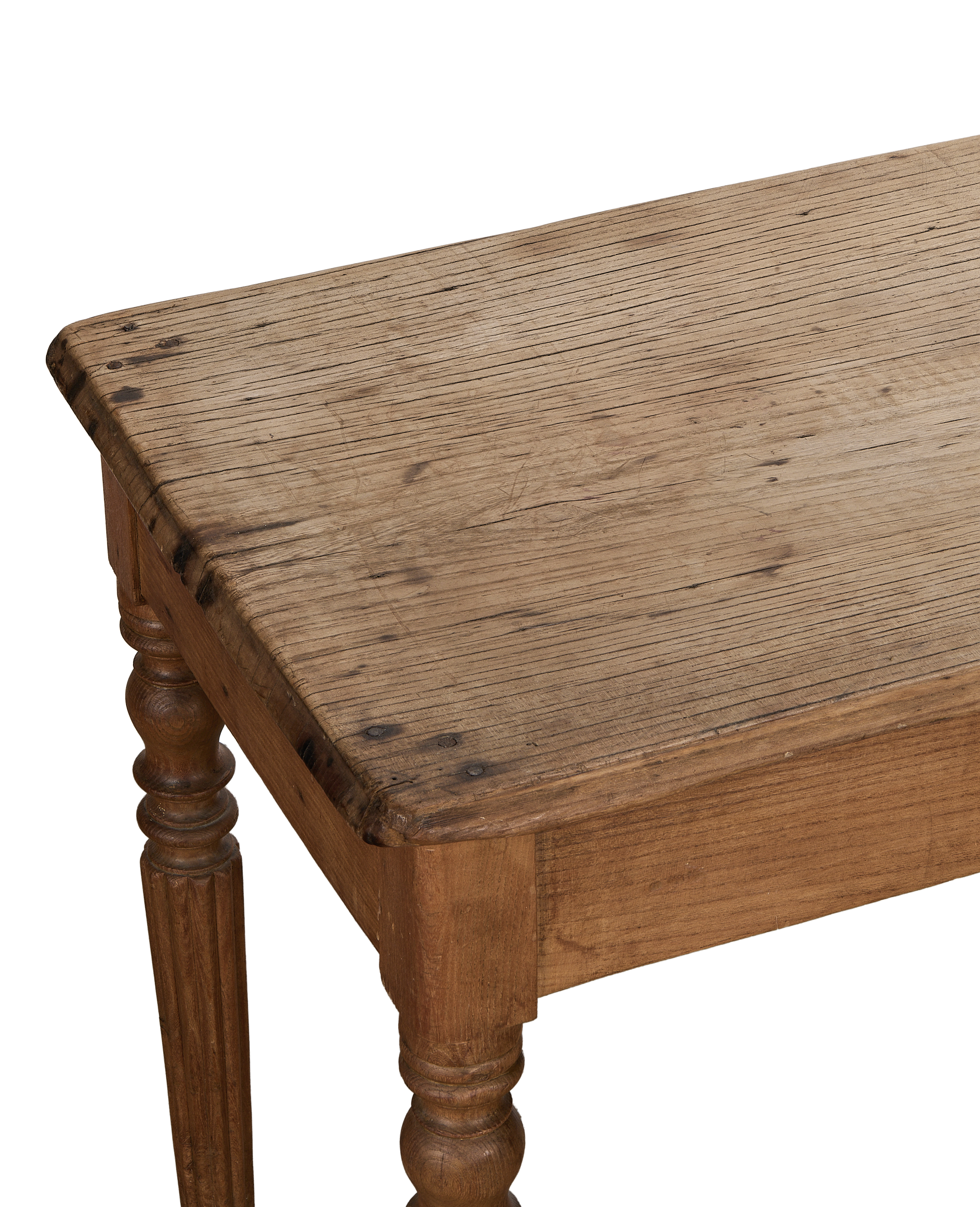 Vintage French oak farm table, close-up of distressed rustic wood tabletop detail with round legs.