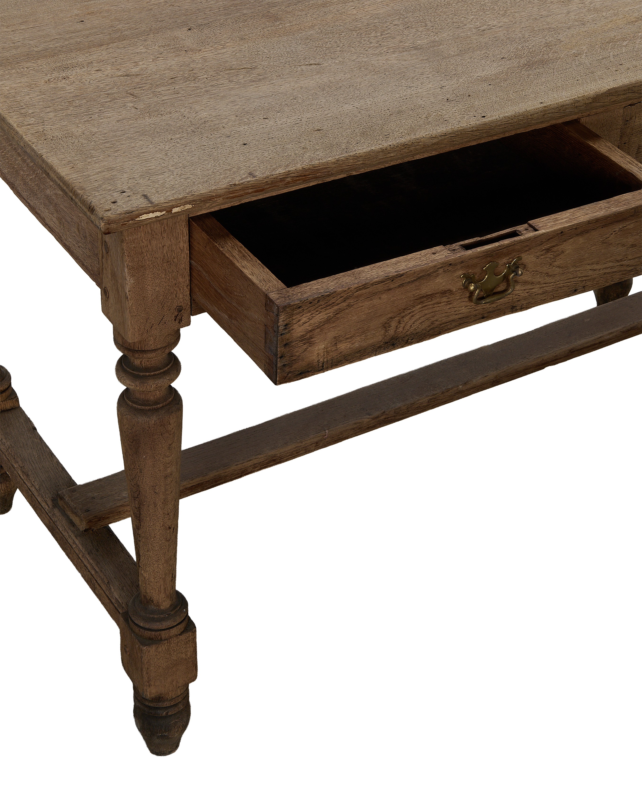 Vintage French oak farm table, open drawer with brass pull, showing aged wood texture.