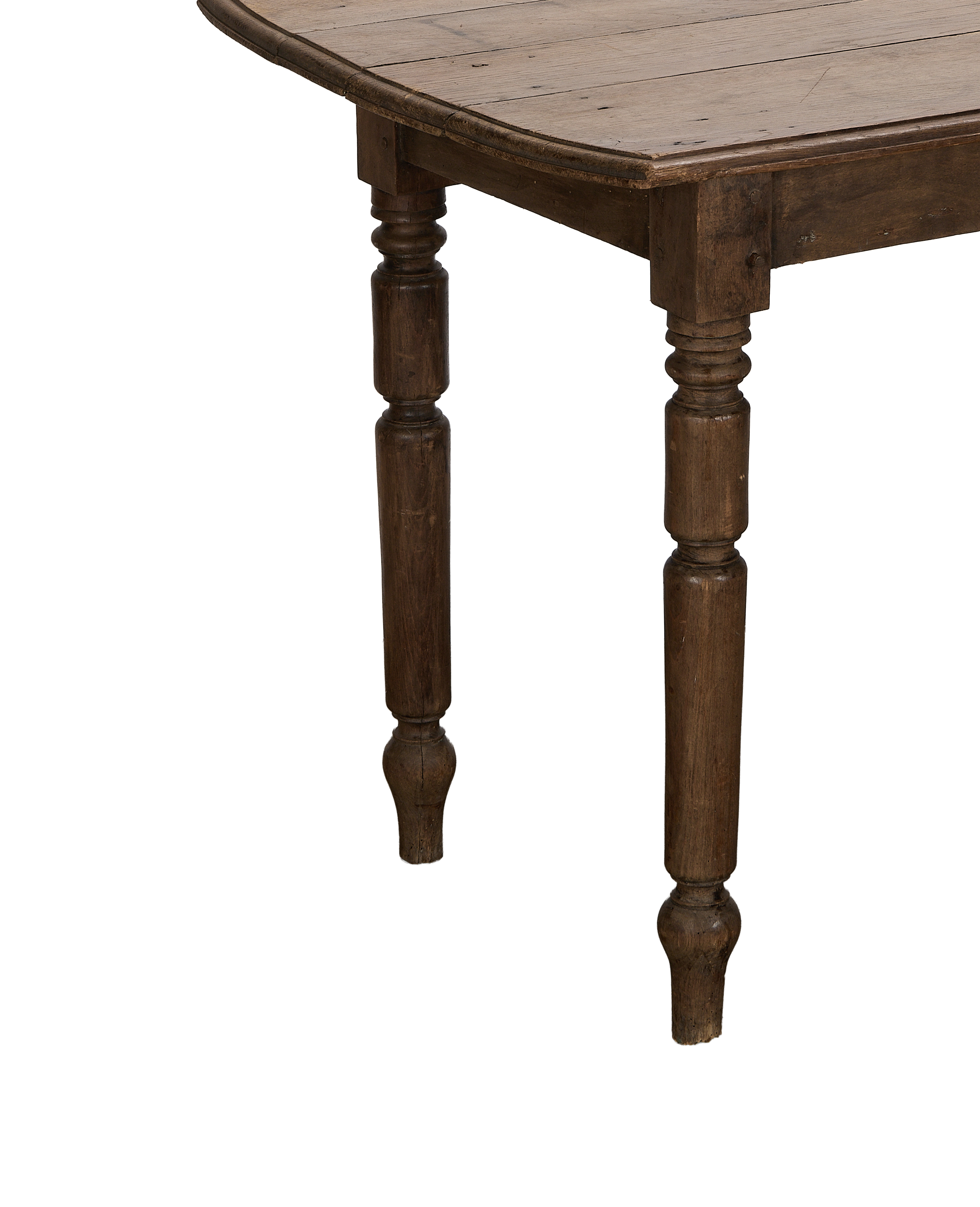 Vintage French oak farm table, showing distressed plank top and carved legs.