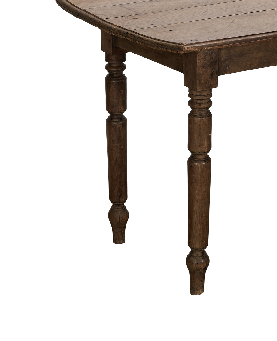 Vintage French oak farm table, showing distressed plank top and carved legs.