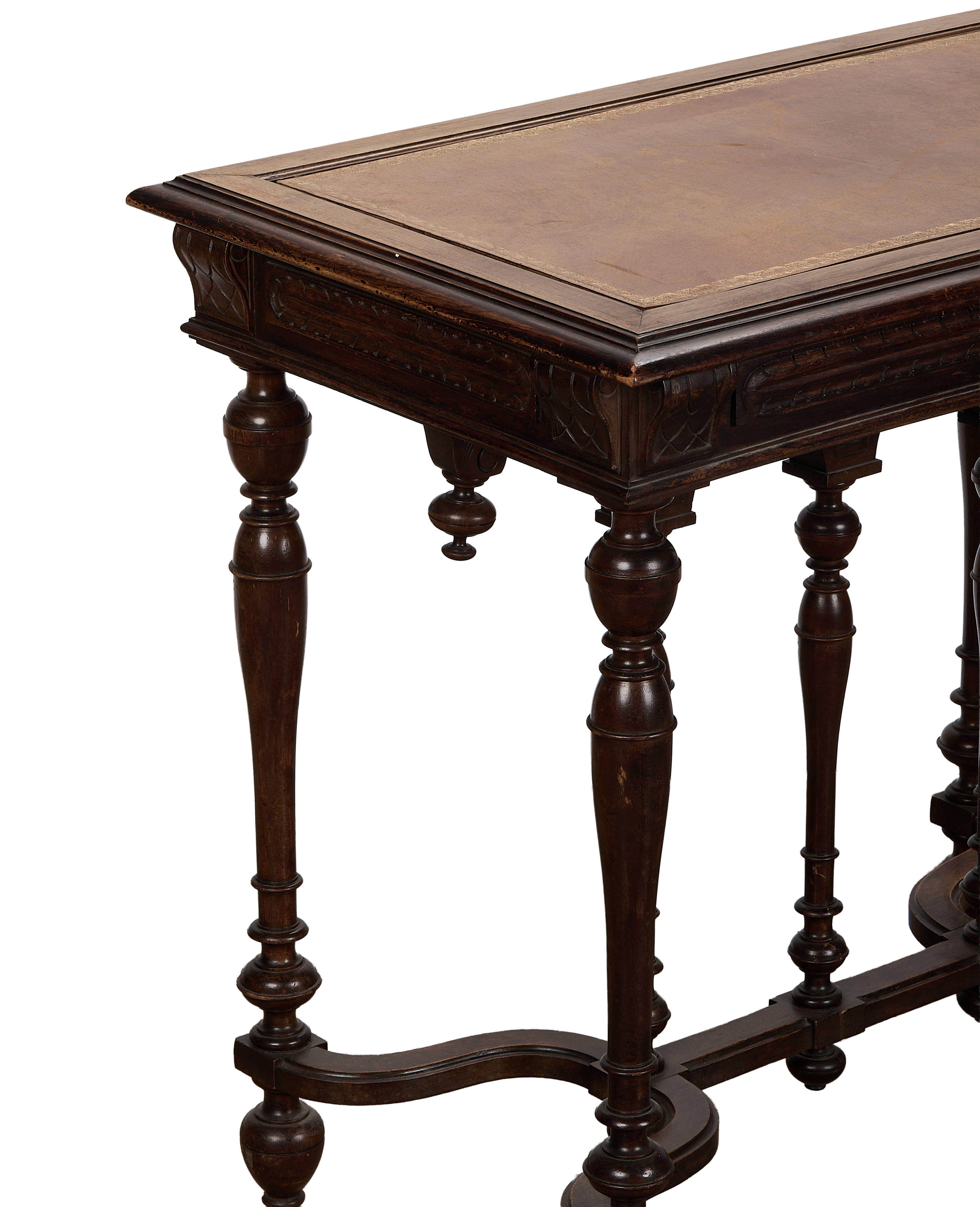 Vintage French oak console table showing intricate carved details, turned legs, and leather top.