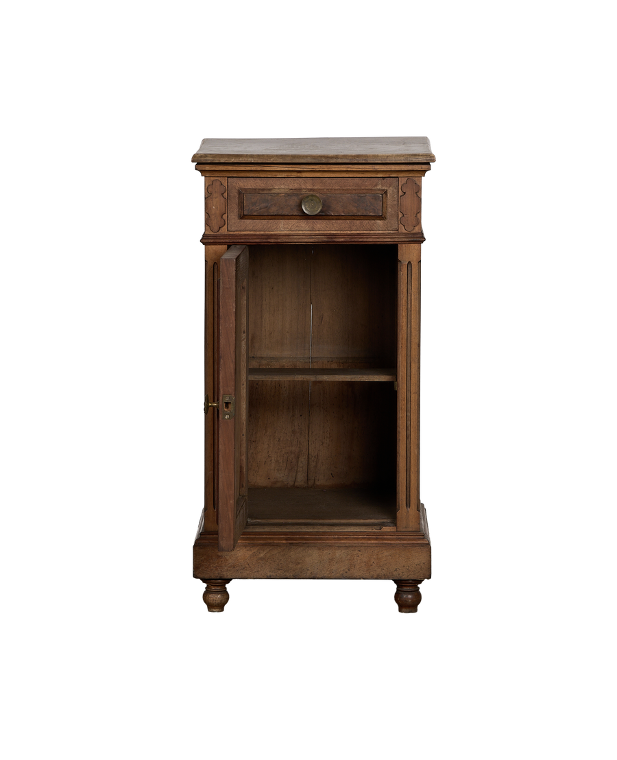 Vintage French oak nightstand, cabinet door open revealing interior shelf and distressed wood finish.