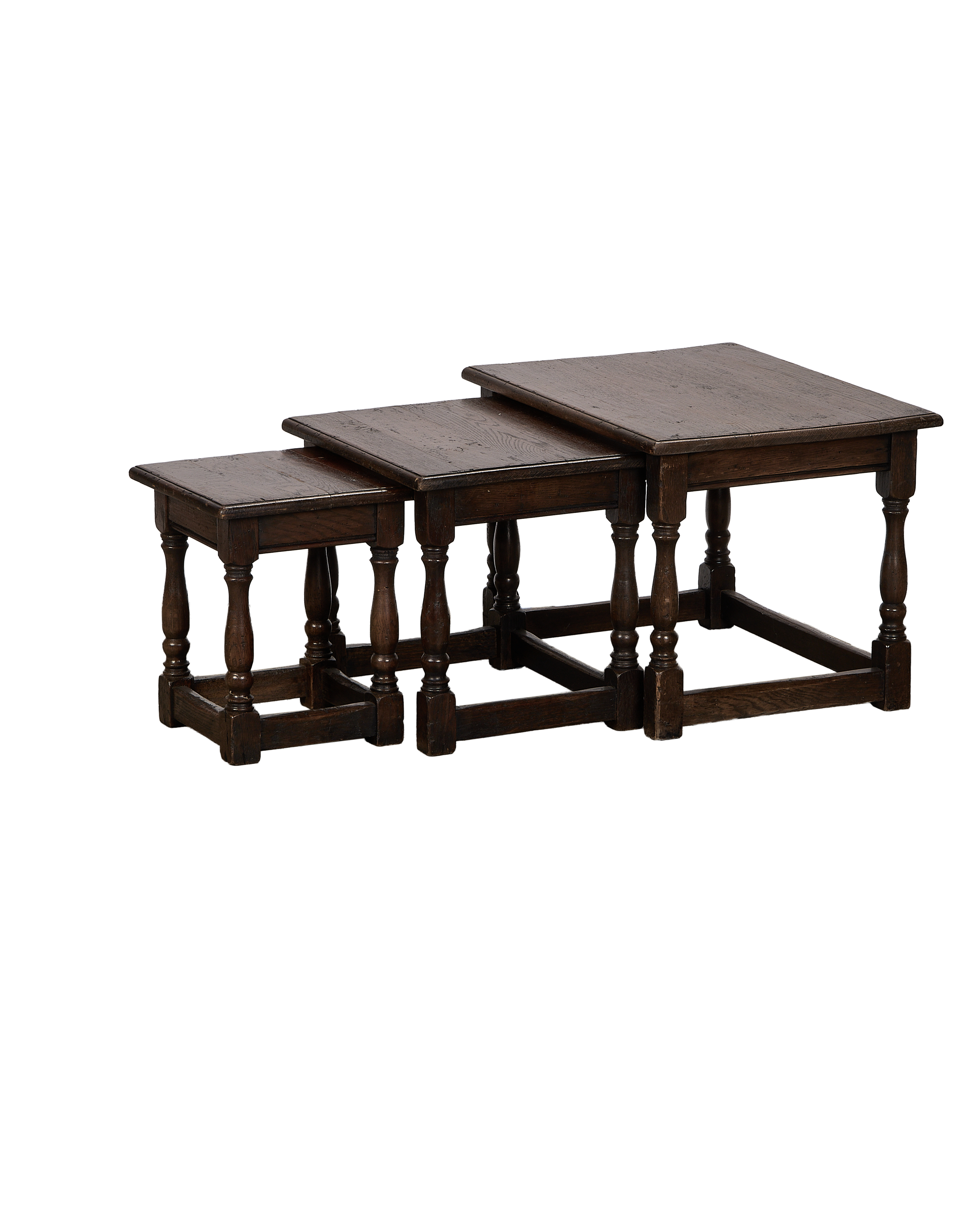 Vintage French oak nesting tables, set of three, dark wood finish on bulbous legs.