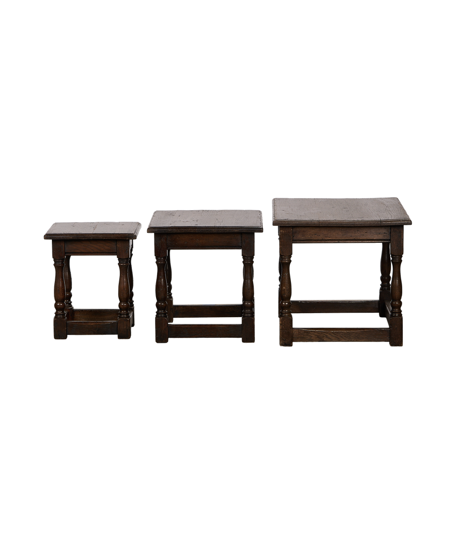 Vintage French oak nesting side tables, set of three, showcasing various sizes.
