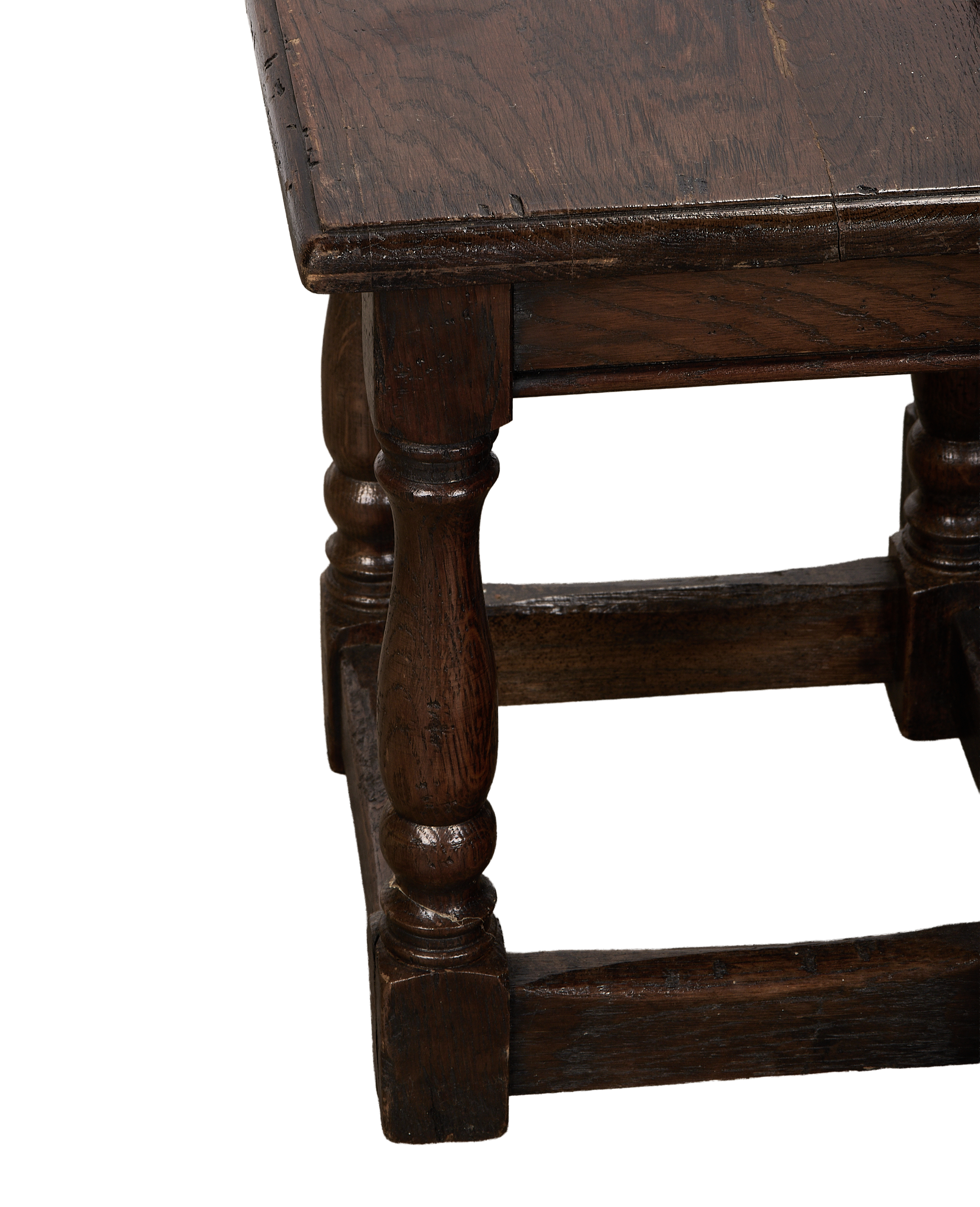 Vintage French oak nesting table close-up, showing detailed turned leg, dark patina.