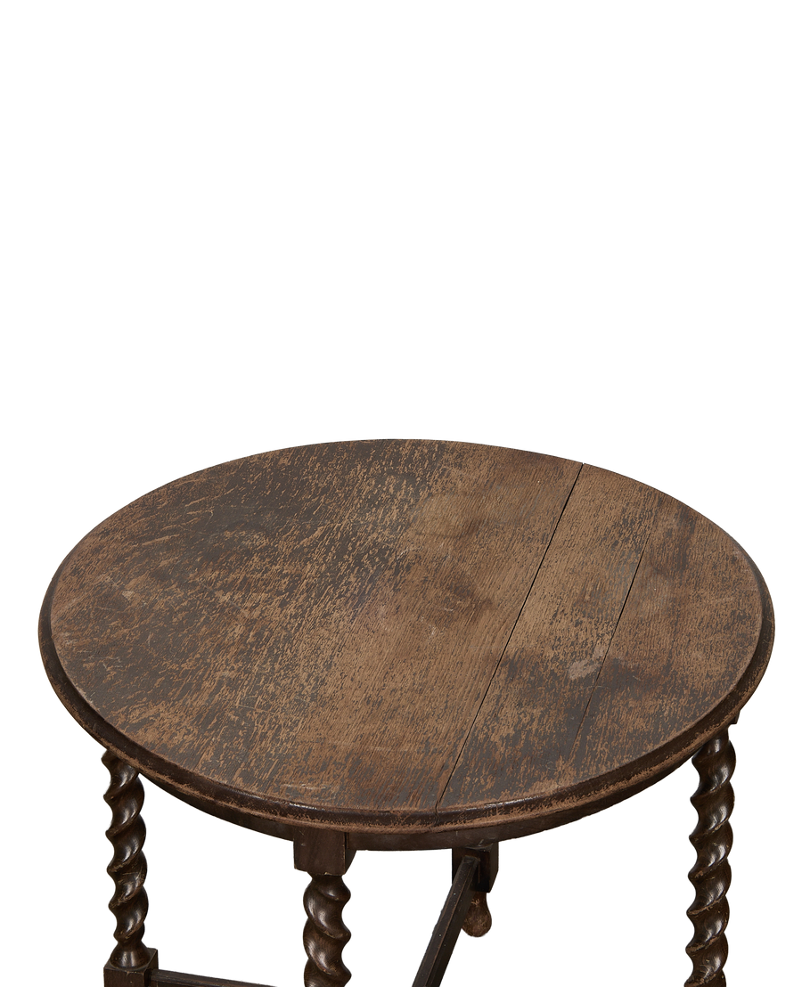 Vintage French oak barley twist side table, close-up of distressed round tabletop.