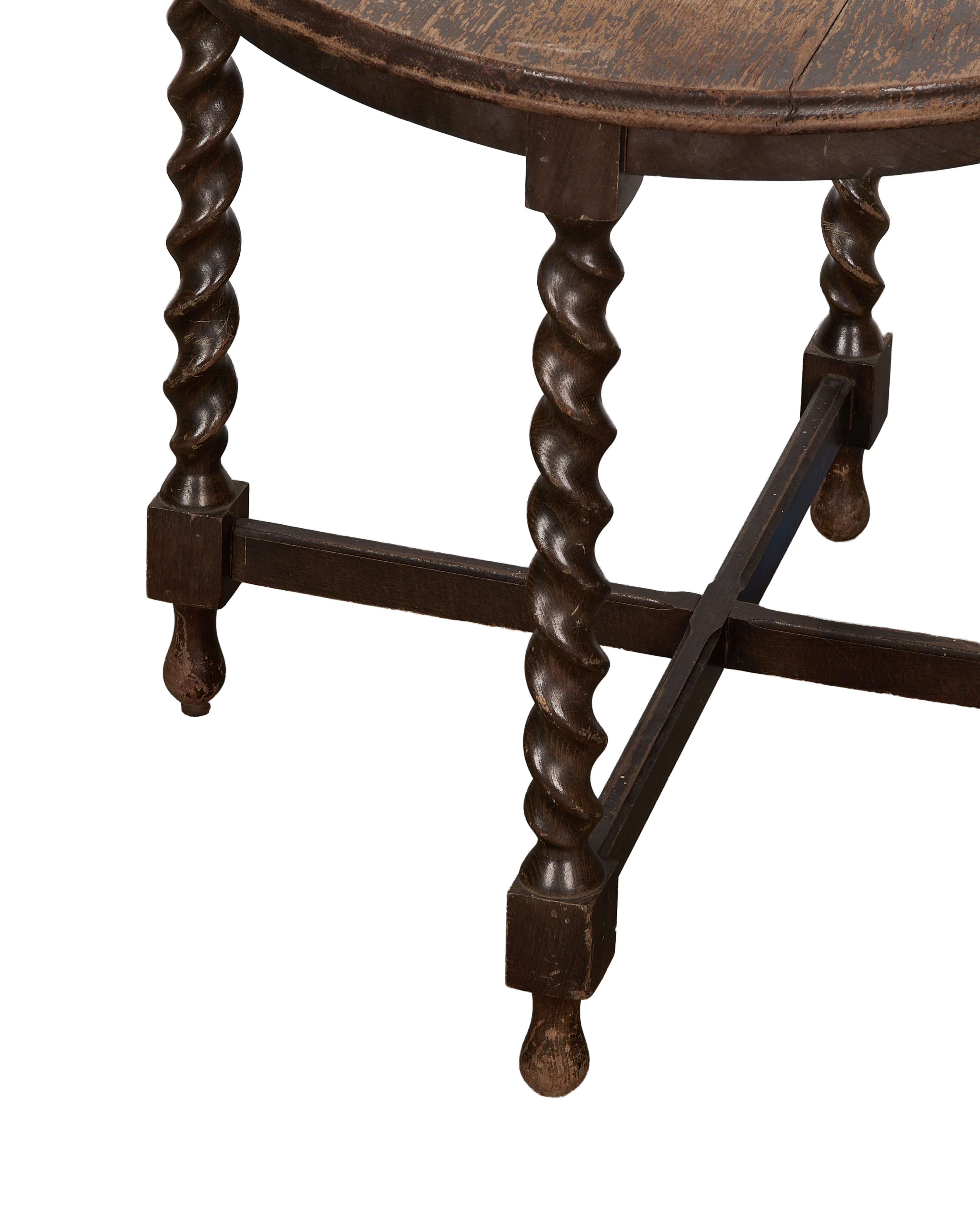 Detail of vintage French oak barley twist side table's ornate legs and cross stretchers.
