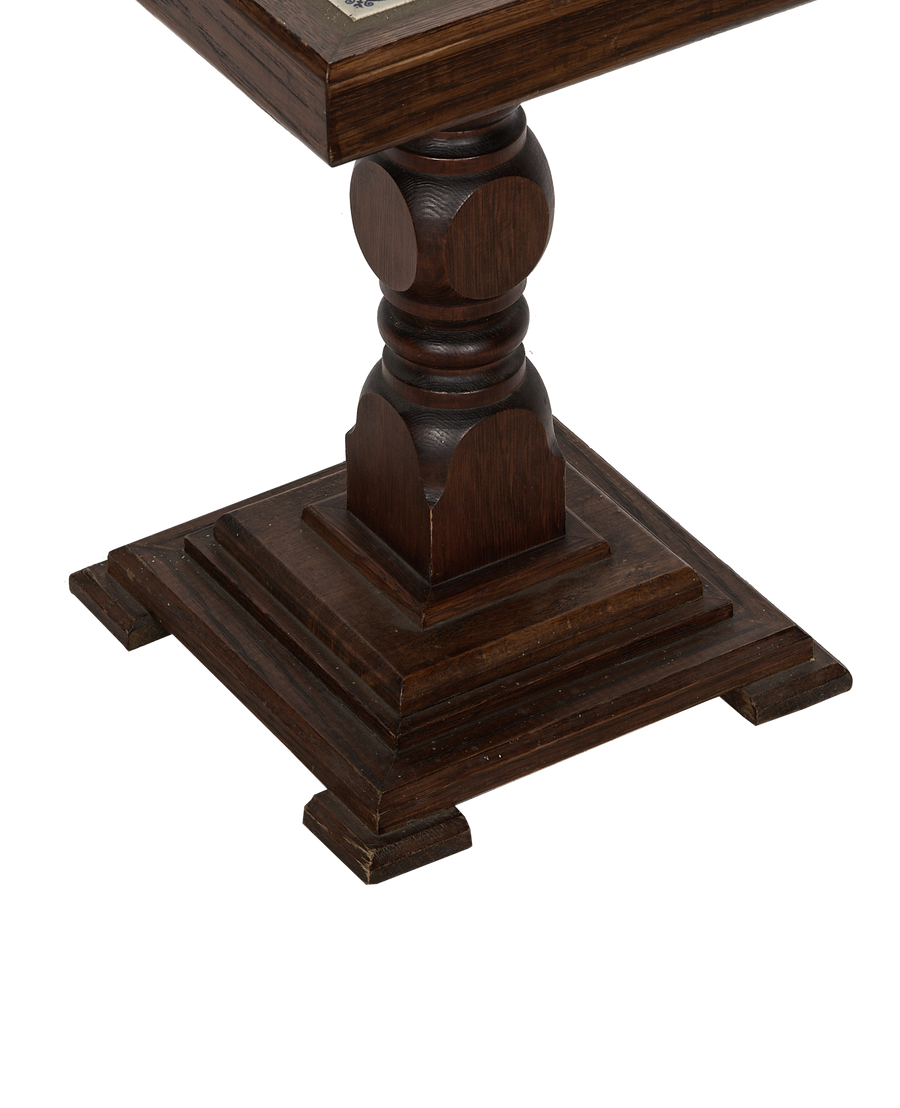 Vintage French oak Delft tile side table pedestal, showing its ornate turned column and square carved base.