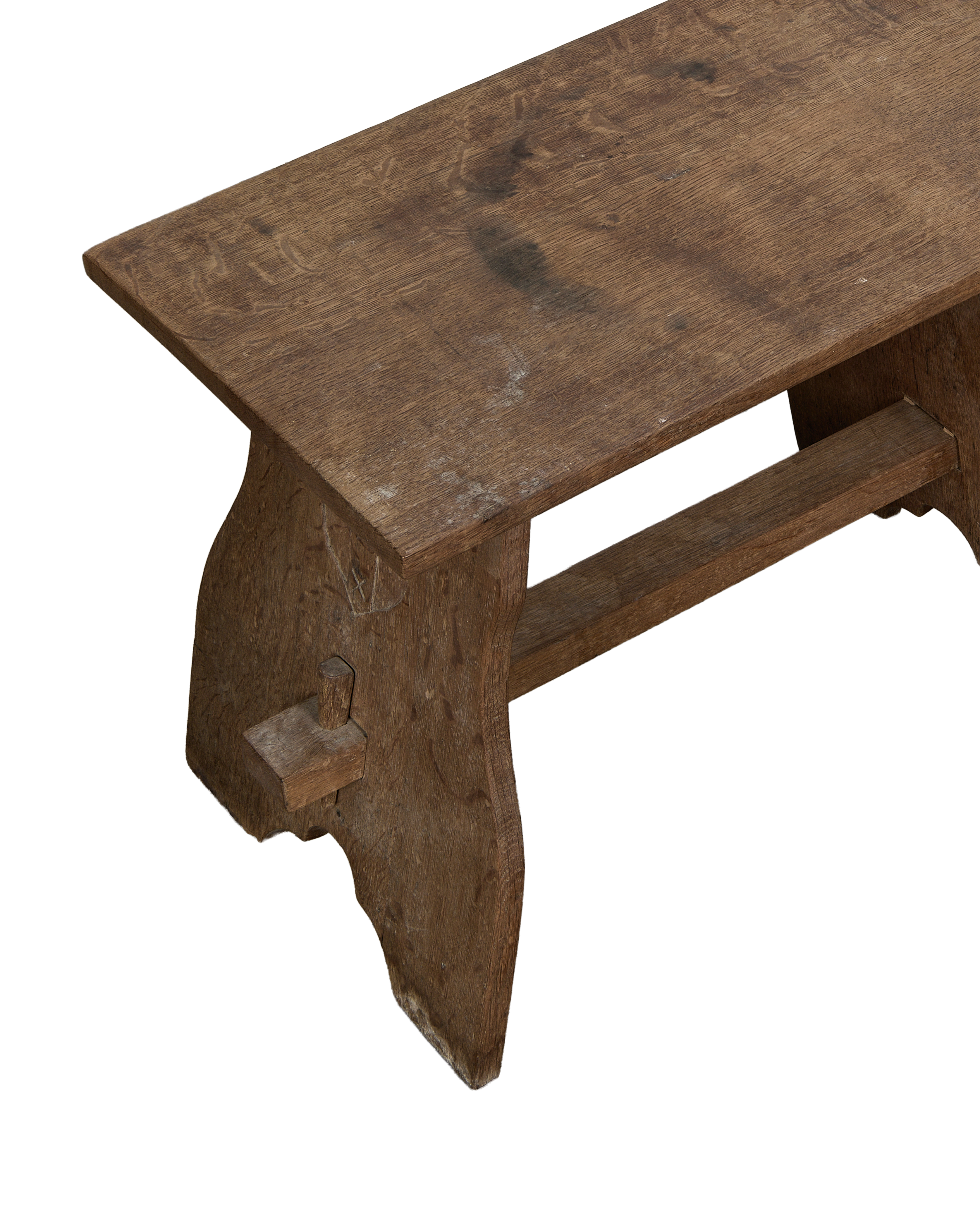 Vintage French oak church stool, close-up top view, showing aged wood grain and dovetail joinery.