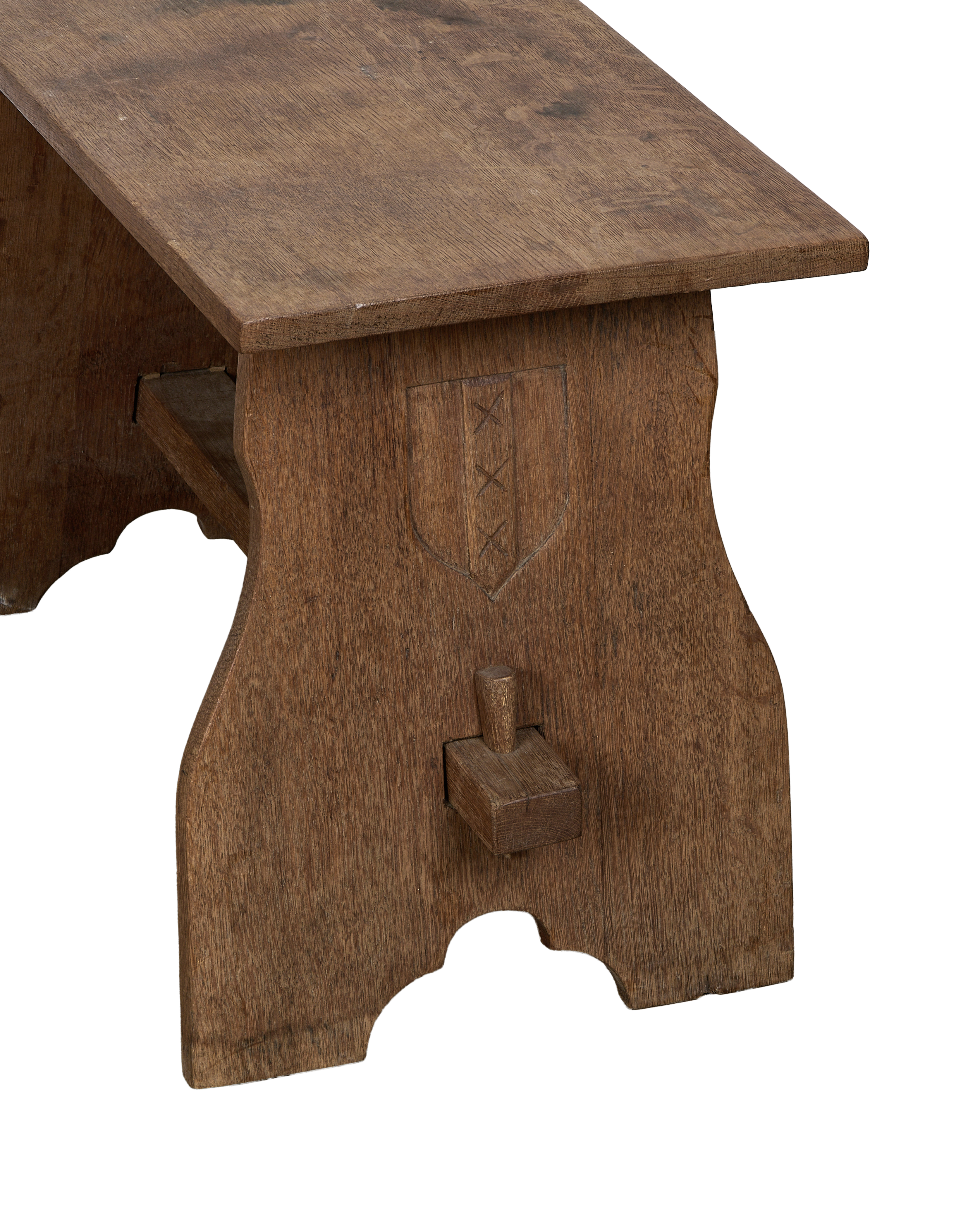 Vintage French oak church stool: side view, showing carved shield with three crosses.