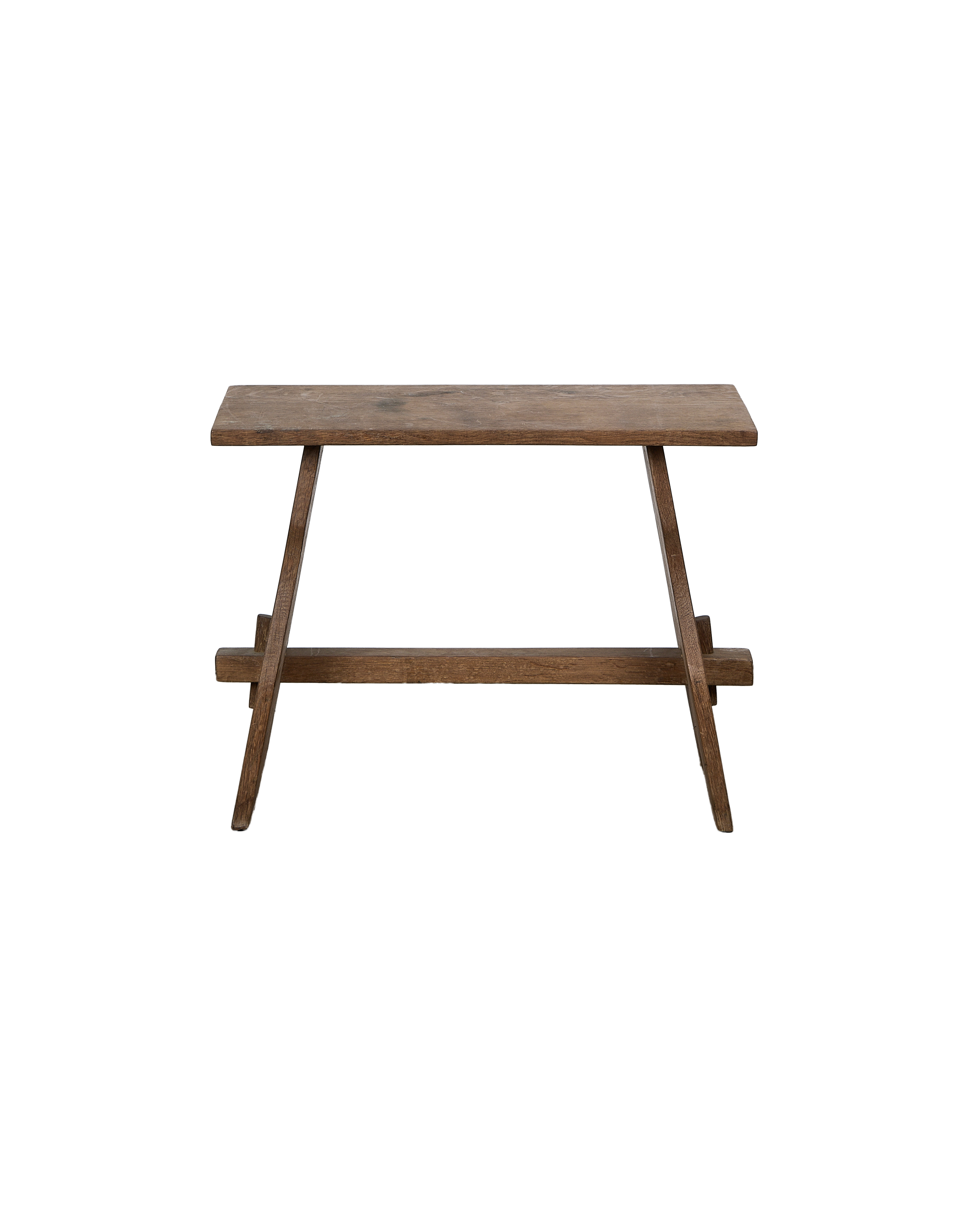 Vintage French oak church stool, close-up top view, showing weathered grain.