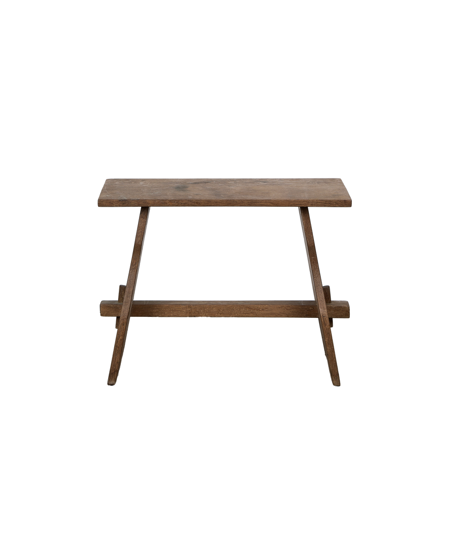Vintage French oak church stool, close-up top view, showing weathered grain.