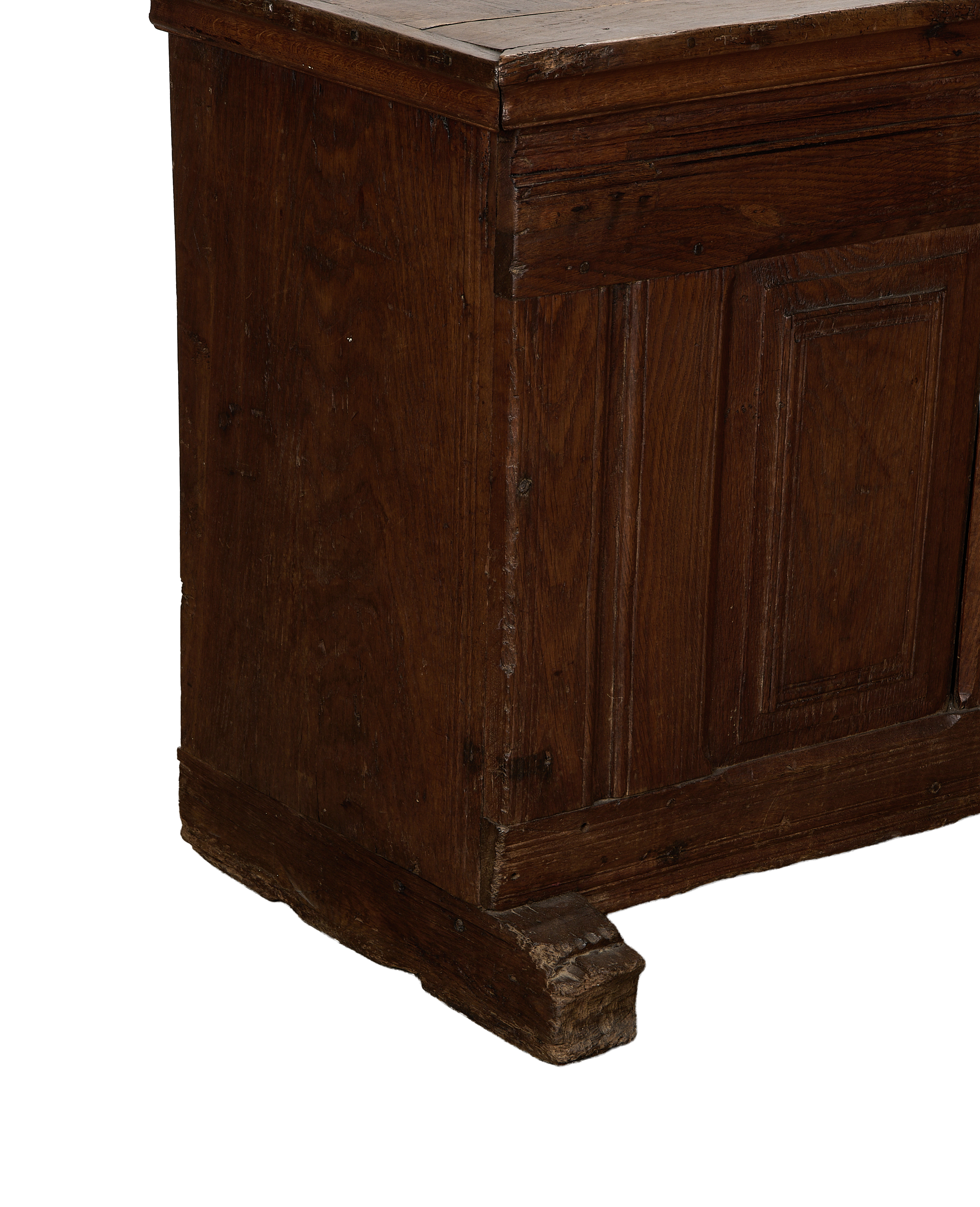 Vintage French oak chest showing detailed, weathered wood grain and base.