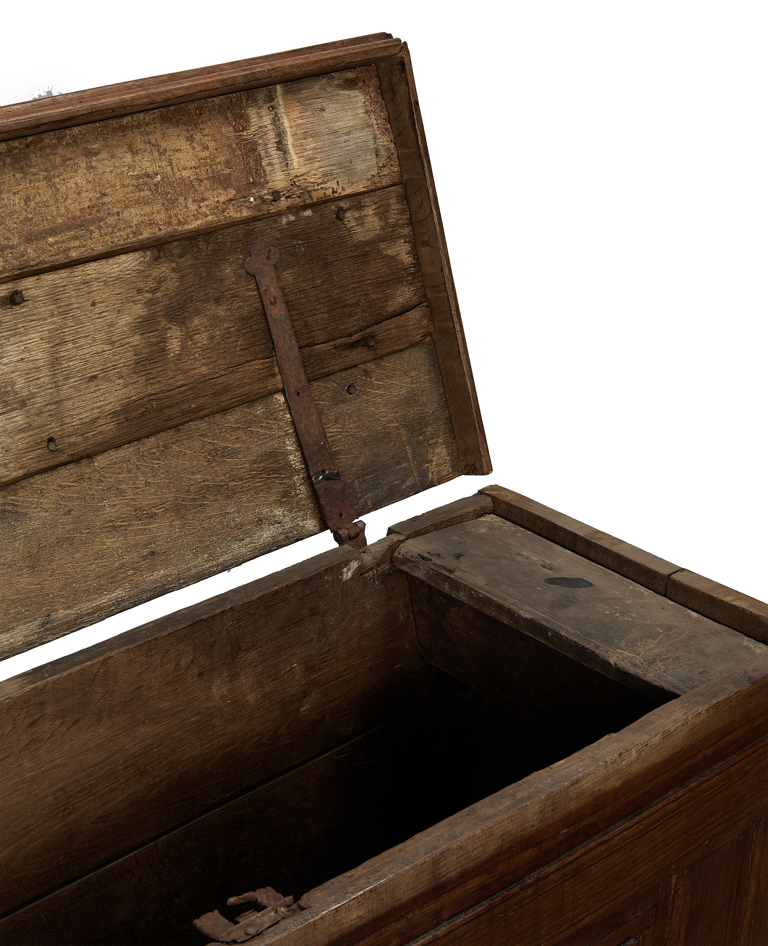 Open vintage French oak wood chest interior, showcasing rustic hinges and aged timber.