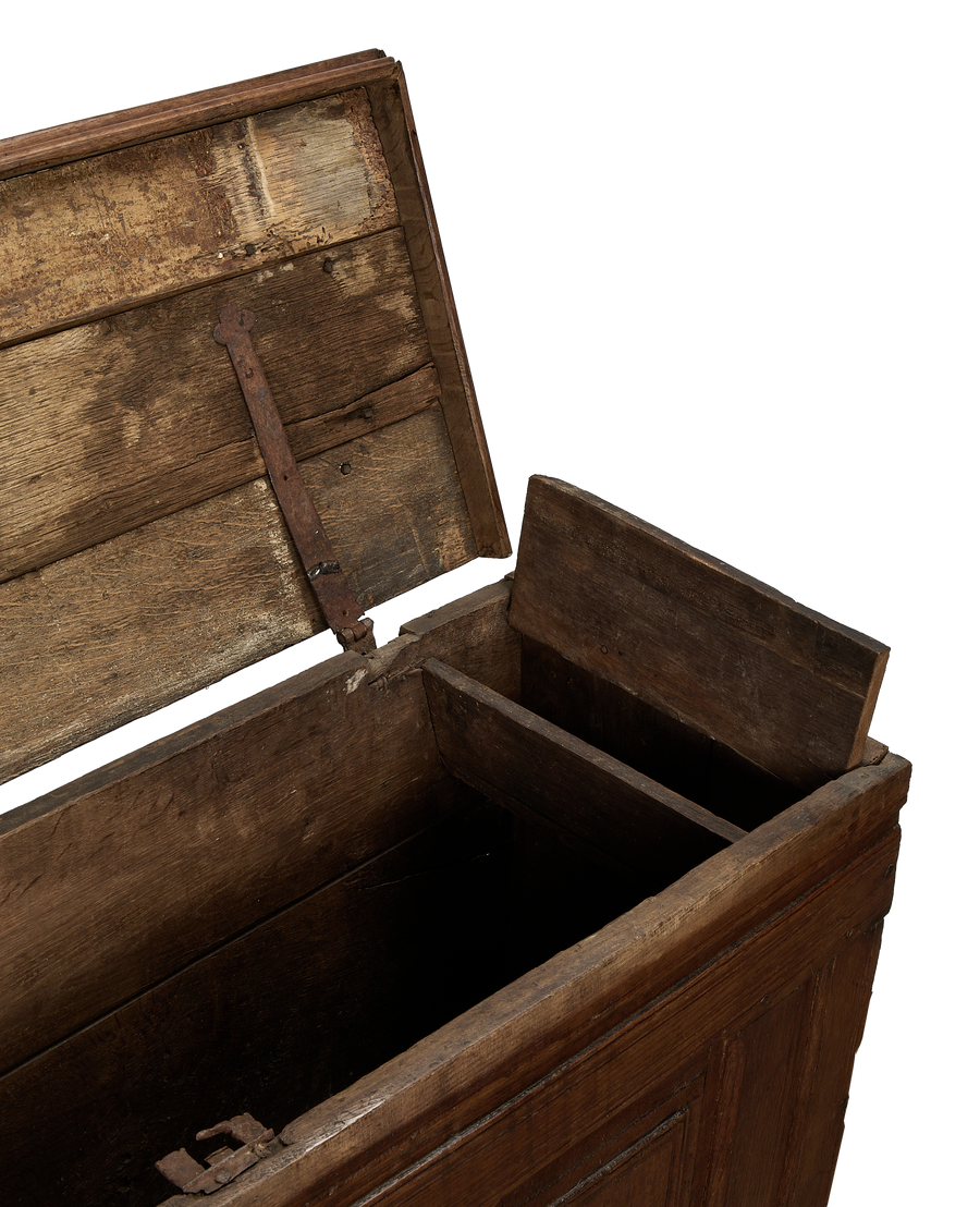 Vintage French oak chest interior, showing distressed wood, rusted hinge, and internal storage compartment.