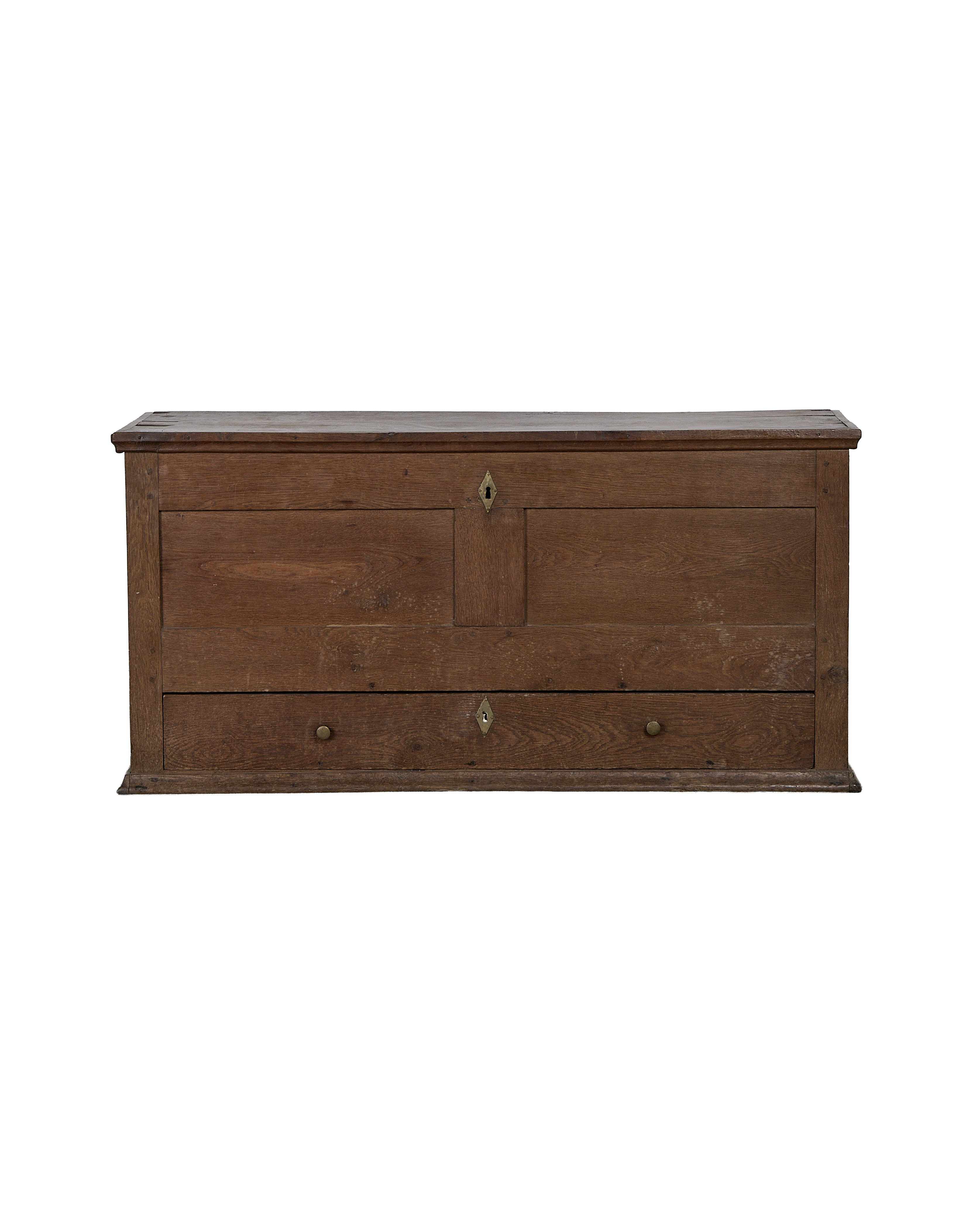 Vintage French oak drawer chest with brass hardware and keyhole detail.